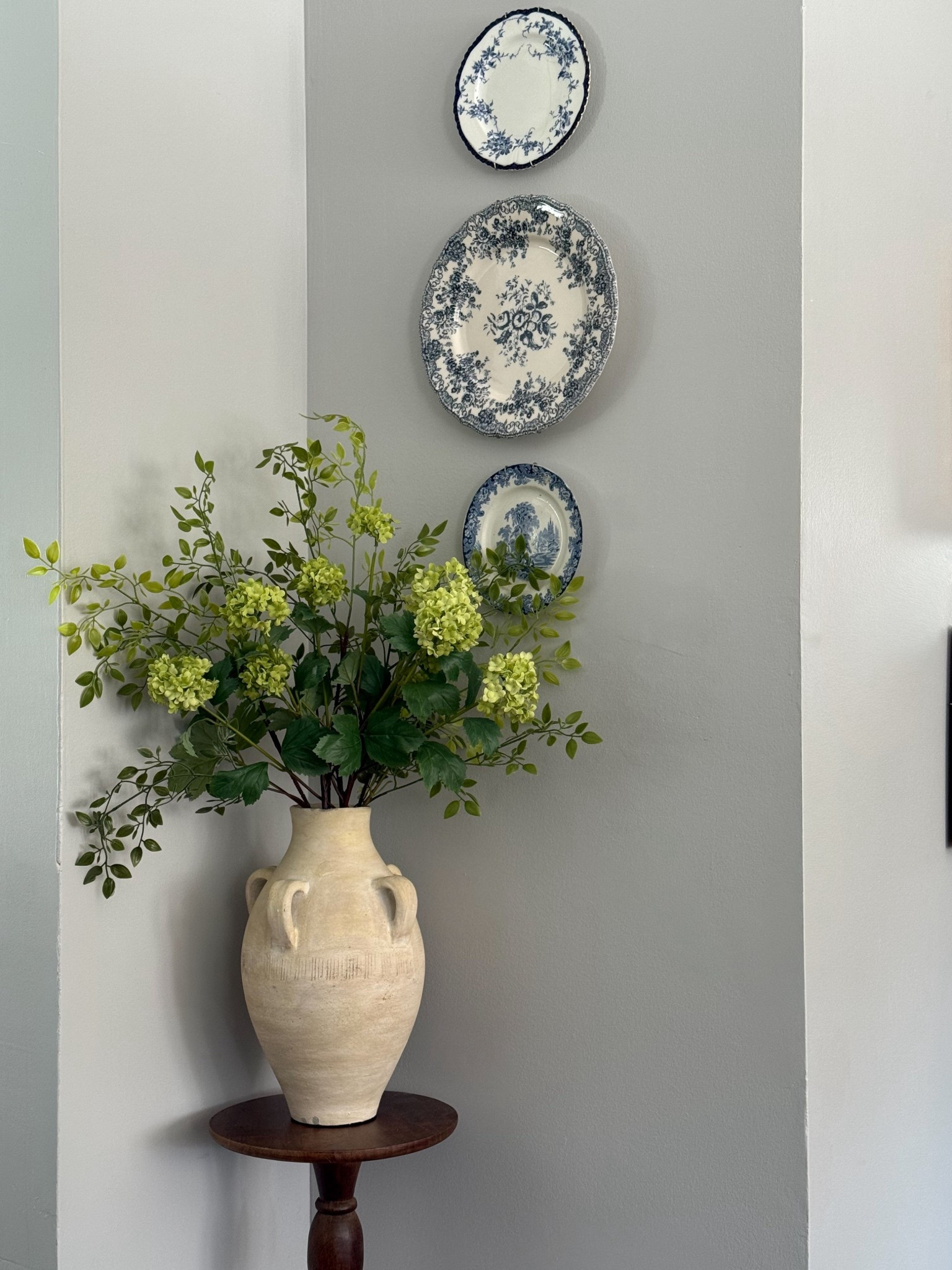 The sweetest little vignette for a tough-to-style corner of the house. The two smaller wall plates I got from Vinted, and the large middle plate is from Zara Home. I got this small round pedestal table at HomeSense, but linked similar ones from Amazon.

#LTKFindsUnder100 #LTKHome #LTKFindsUnder50