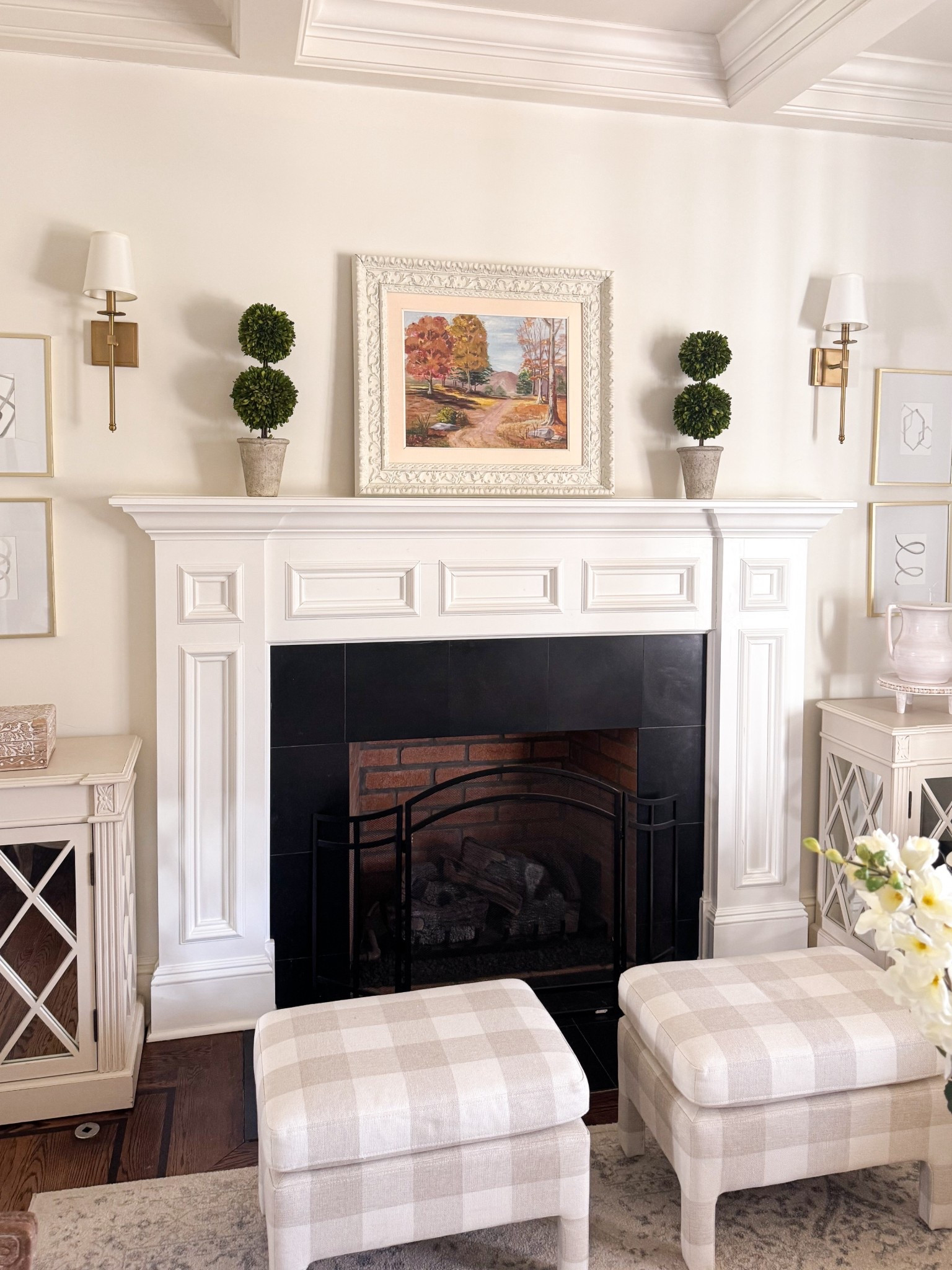 Topiaries and plaid bench fireplace mantle

#LTKHome