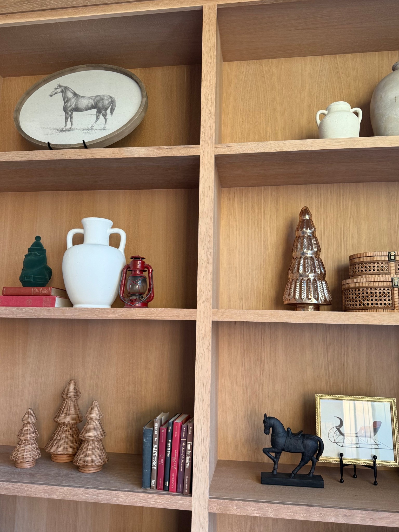 Christmas holiday built in book shelf decorations! Glass and wicker Christmas trees! 

#LTKHoliday #LTKHome