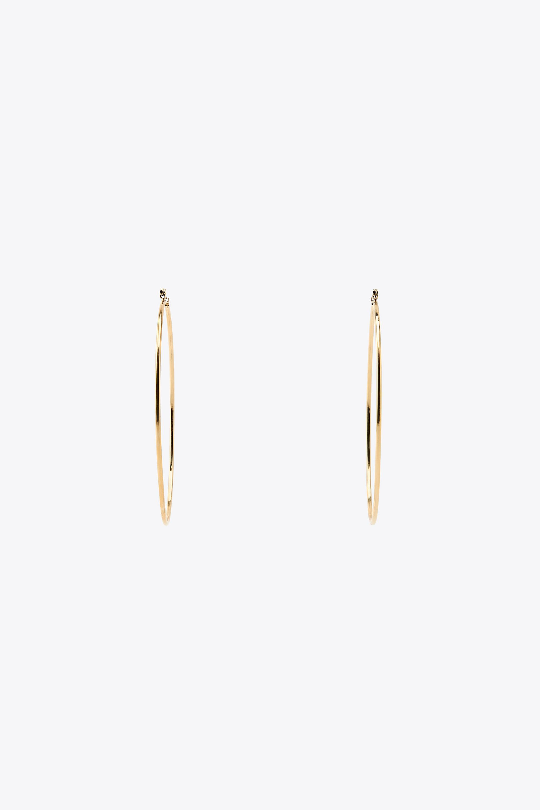 Thin metal hoop earrings with a diameter of 2.75 inches (7 cm). Push back closure.Stainless steel... | Zara US