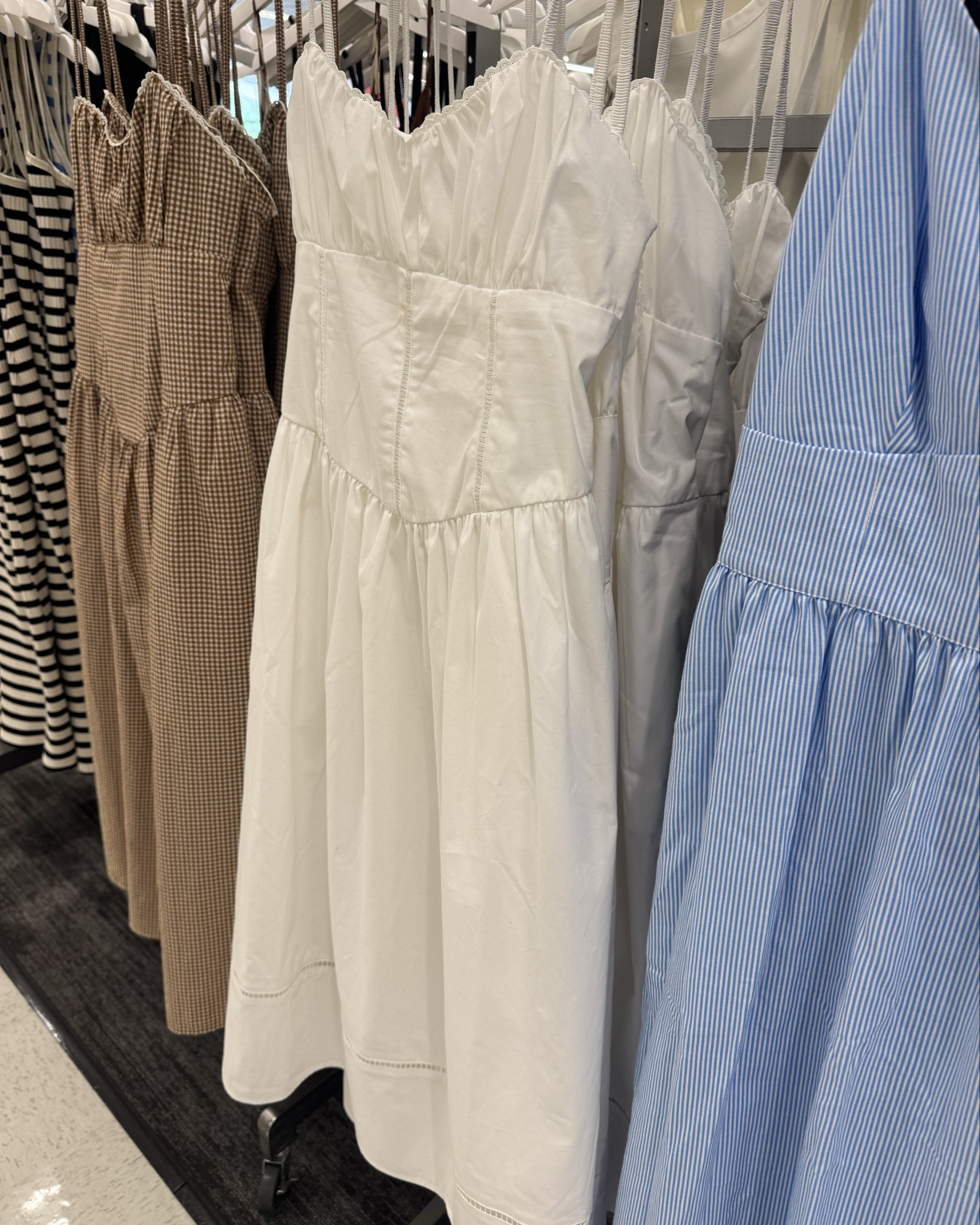 Target spring dress find 🌸

This corset midi is so cute and flattering—gives you shape without feeling too much. Easy to dress up or down…works with boots or sandals and pairs really well with a jean jacket.

Comes in a brown gingham and a blue floral—both perfect for spring 🤍

#LTKOver40 #LTKmomlife