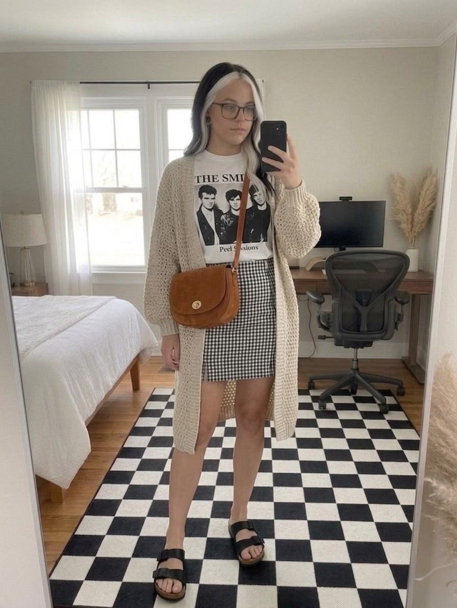 Effortlessly cool and cozy! Mixing vintage vibes with everyday comfort featuring a classic graphic band tee, a cute gingham mini skirt, and the ultimate long chunky knit cardigan. Accessorized with a tan suede crossbody bag and comfy double-strap slide sandals for an easy, casual look.

#LTKootd #LTKSeasonal #LTKMidsize