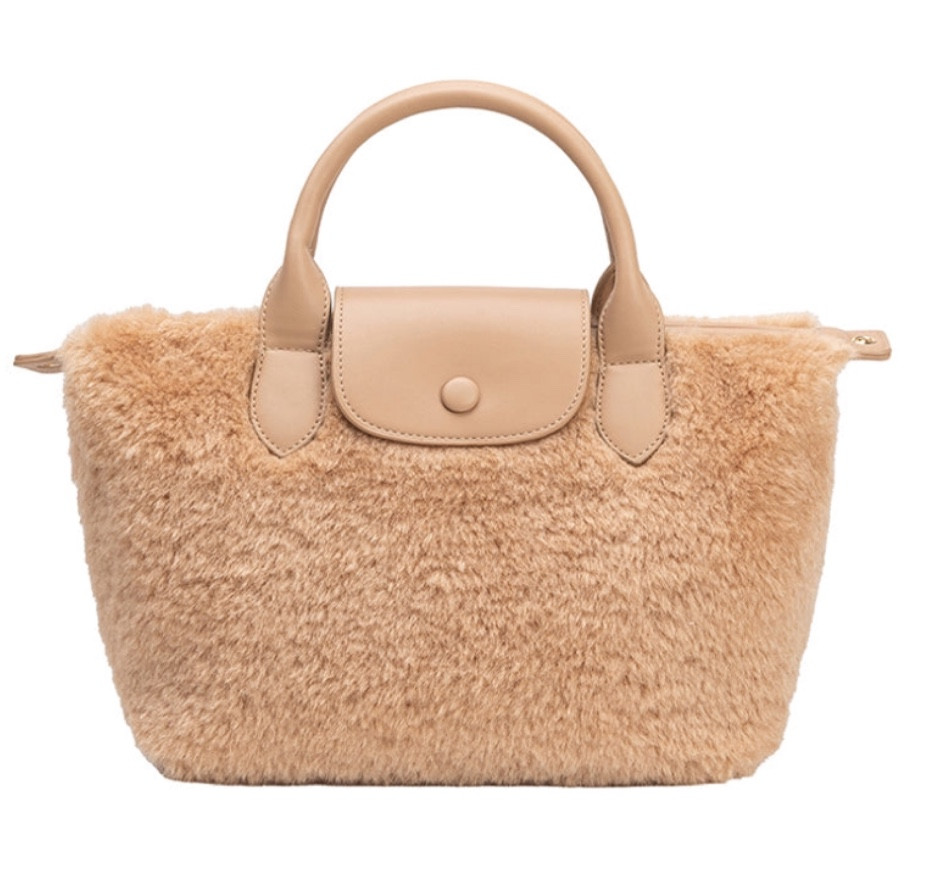 Winnie Tan Sherpa Tote Bag

Expertly designed, the Winnie tote features a crossbody strap for versatile wear while the sherpa material adds a touch of comfort and style. With a top handle for easy carrying, this functional tote offers both style and practicality. The spacious interior allows for ample storage.

#LTKItBag #LTKGiftGuide #LTKWorkwear