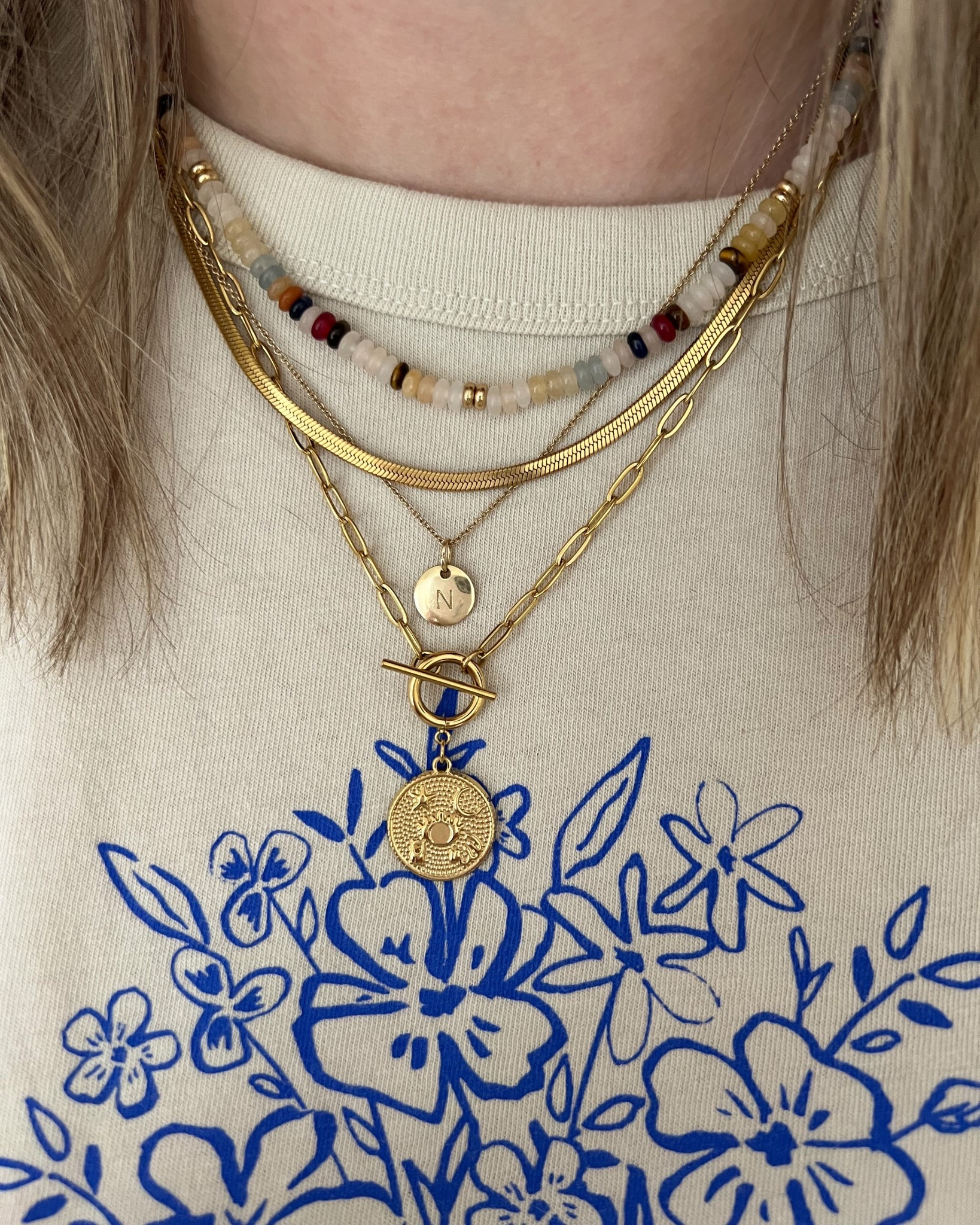Spring & summer necklace stack! Colorful beaded necklace paired with gold herringbone chain, toggle pendant necklace & initial necklace 
Everyday jewelry, layered necklaces, summer jewelry trends 


#LTKspring #LTKstyletip #LTKsummer