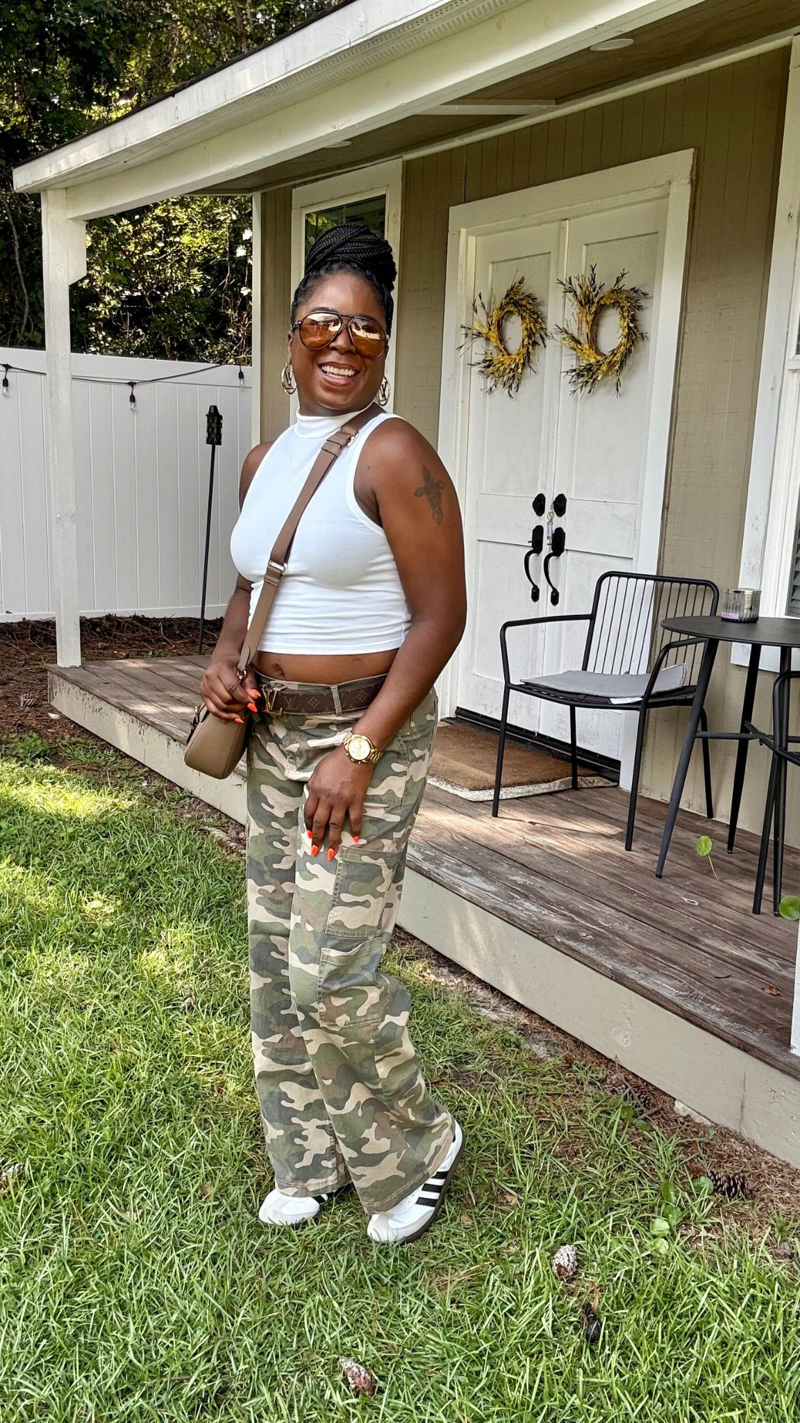 The simple changes I made to style camo cargo pants. I styled this casual outfit with a white crop top, Addidas Sumbra sneakers, Coach crossbody & LV accessories.  

 #LTKOver40 #LTKSaleAlert #LTKFindsUnder50