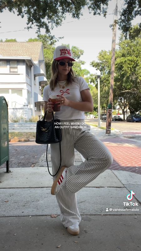 5/13/24 Casual boxer pants outfit 🫶🏼 boxer pants, boxer shorts, boxer shorts trend, striped pants, striped pants outfit, summer fashion trends, summer fashion essentials, bow tee, bow tie t-shirt, red outfit, red Adidas sambae, Adidas sambae sneakers, red trucker hat, trucker hat outfit 