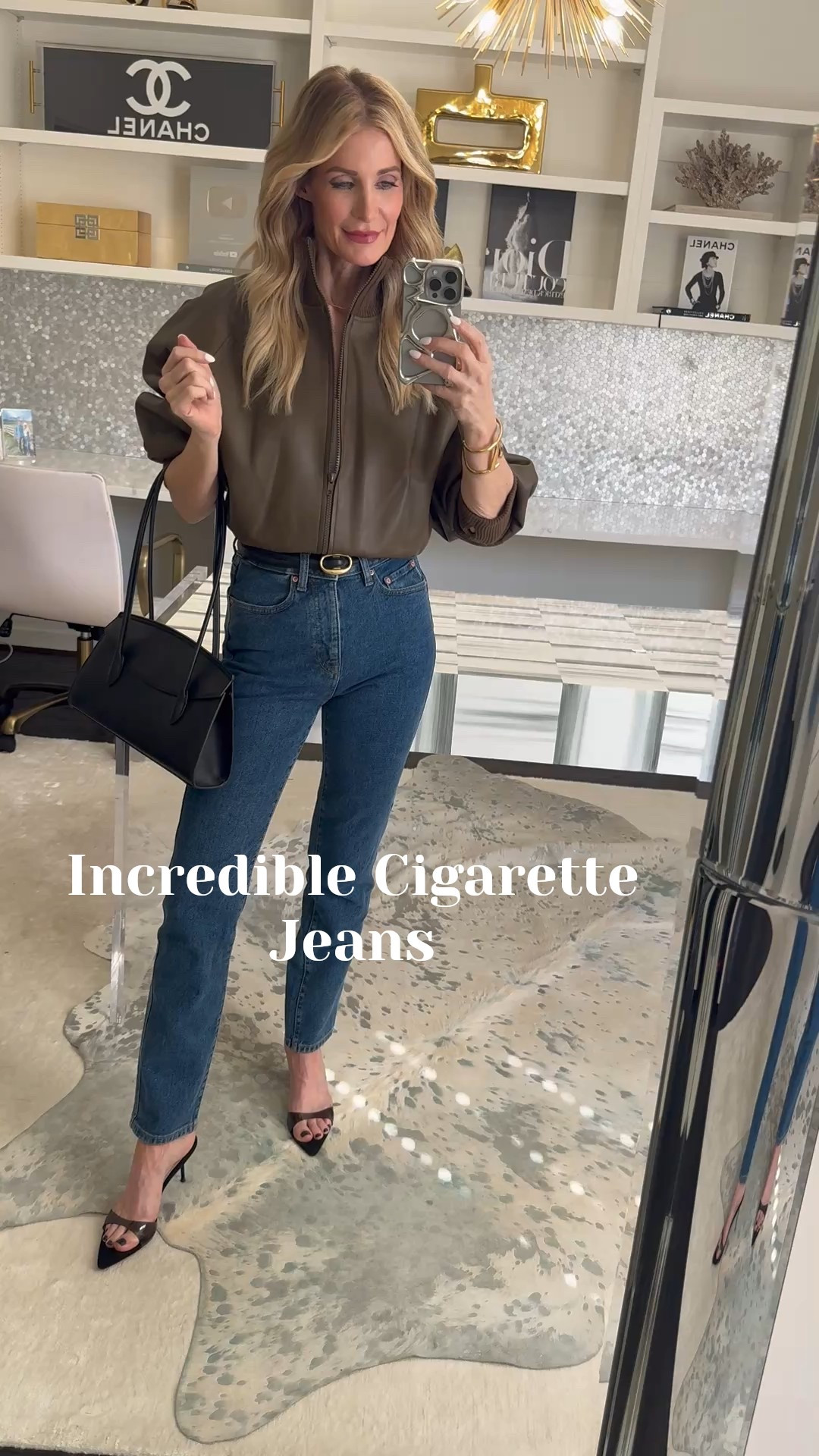 The bomber jacket trend is still going strong, and this vegan leather version is such a chic, wearable way to try it. I love zipping it halfway and tucking it under for a slightly cropped fit — it defines your waist and gives that effortless, cool-girl shape. The Dolman sleeves add structure without bulk, which makes the whole look feel modern and flattering. I paired it with these insanely slimming cigarette jeans in a dark wash — the fit is incredible and the back pockets are perfectly placed to lift and shape. This is one of those outfits that instantly makes you look polished, streamlined, and put together.

Wearing XS in the bomber jacket and 24 in the jeans. ✨ 

 #LTKgrwm #LTKootd #LTKOver40