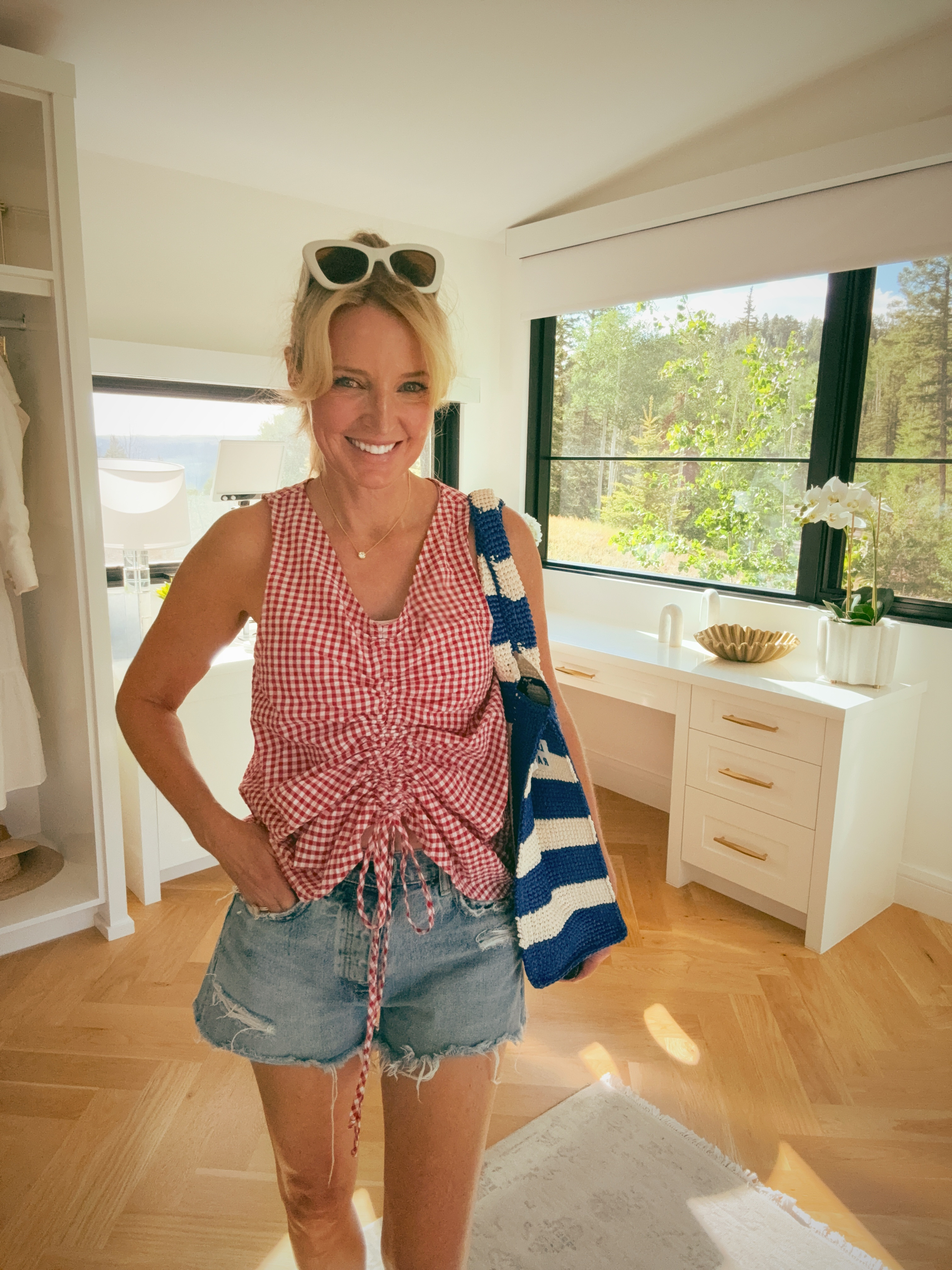 This is the kind of casual outfit that looks like you tried without trying at all. 

The Le Bop ruched front top in red gingham is such a good summer find, and Moussy Vintage denim shorts are the ones worth splurging on.

#LTKootd #LTKgrwm #LTKOver40