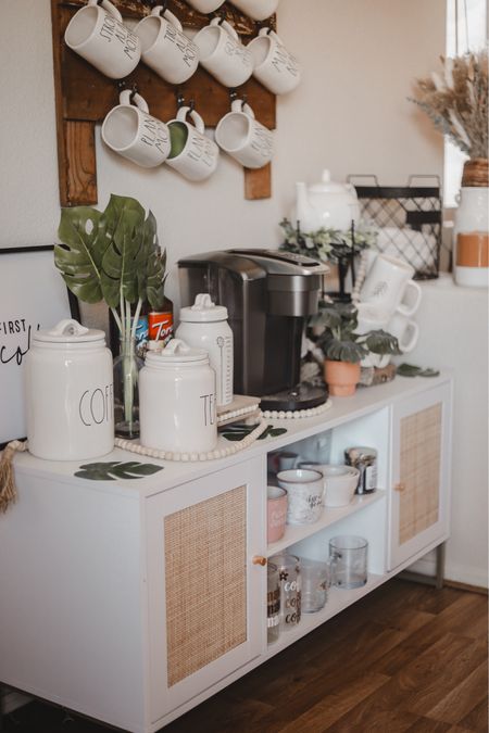 My coffee bar needed a makeover and this @nathanjames tv stand was perfect for that! It’s so gorgeous & has so much space for me to store everything from teas, to coffee, mugs, syrups and more! 😍 I was thinking about adding my nepresso machine here as well! Mama has been living off coffee and energy drinks these last few weeks! You can snag yours on my Amazon storefront under coffee must haves or on my LTK 😚 #nathanjames #nathanjamespartner #amazonmusthaves #amazonmusthave #amazonfinds #amazoninfluencer #amazonshopping #bohohome #bohohomedecor #kitchenmusthaves #coffeebardecor #coffeebars #raedunnclay #raedunnmugs #raedunnobsessed #raedunnlife #raedunnaddiction #raedunndisplay #keurig #keurigcoffee #keurigcoffeemaker 

#LTKFindsUnder50 #LTKFamily #LTKHome
