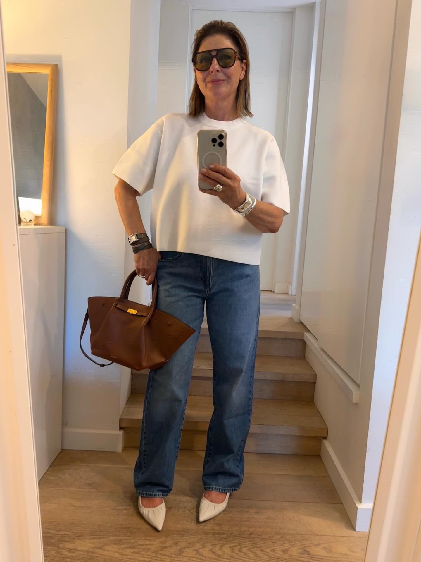 What’s new in a white tee ?
It’s loose, oversized, roomy with a square cut. The fabric can be quite structured ( doesn’t cling, holds its shape!). The sleeves are wide and long. This one is a fab length, you don’t need to tuck it in . This knit Tee is also in brown - swipe 

What’s new in jeans ?
These jeans are the best cut ! 
I ordered them thinking “ I do not need another pair of jeans” 
But when I put them on ; fabulous!
A straight leg is looking cool right now, with a neat high waist. Love this blue wash. Longer length. ( but don’t worry wide leg & baggy jeans are still so right ).

Both these pieces are @uniqloau ( & the barrel leg pants !) and they are the missing basics you need in your life ! 

I’m wearing a size large in the knit tee.
And size 30 in the JW Anderson jeans in colour 63.



#LTKaustralia #LTKstyletip #LTKover50style