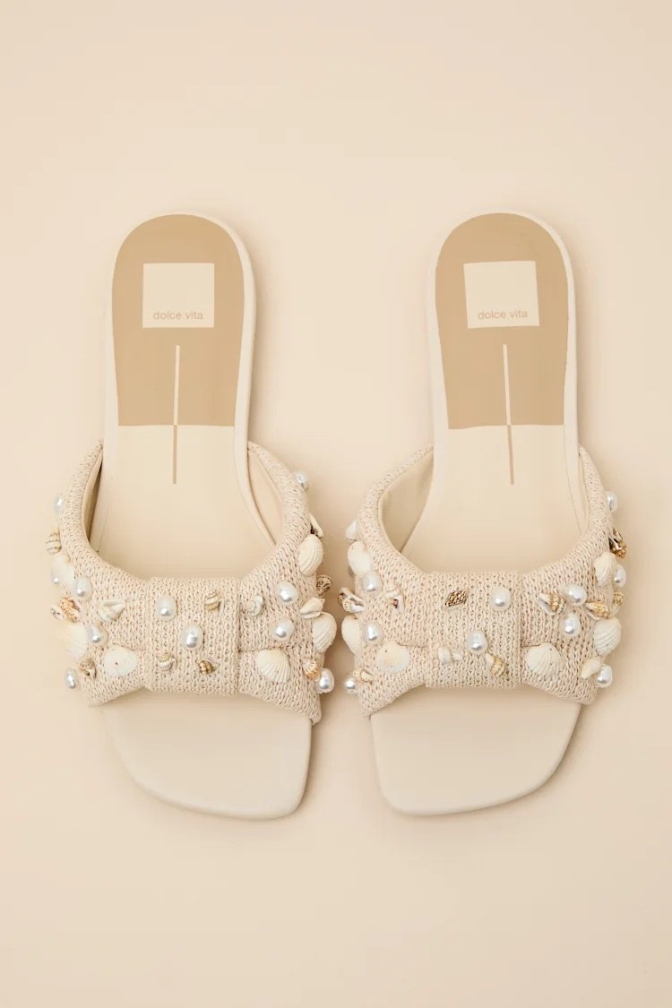 Inspired by Mediterranean summer minimalism, these raffia sandals feature soft neutral tones and textured beading that feel light, natural, and refined. The slide silhouette keeps the overall look effortless and wearable. Under $140.

Keywords:

* raffia slide sandals
* beaded sandals
* oatmeal sandals
* woven slide sandals
* summer sandals
* resort wear shoes
* coastal style footwear
* neutral sandals
* vacation sandals
* casual chic sandals
* Mediterranean style fashion
* beach vacation shoes

#LTKootd #LTKSwim #LTKTravel