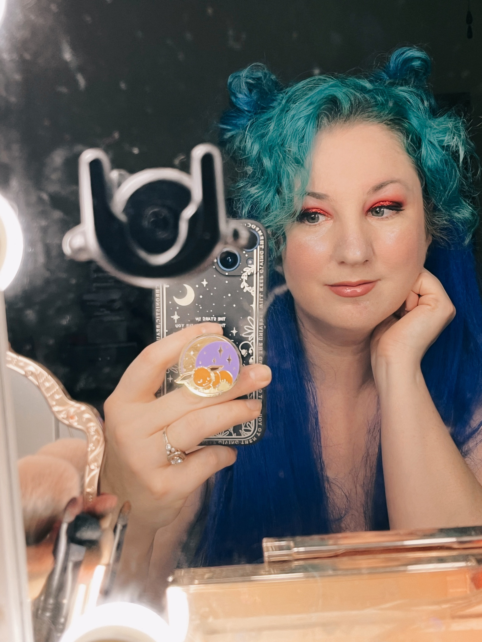 Today’s makeup look. Love this eyeshadow. By @nocturnaalchemy  loveeee it! And using @elfcosmetics
My skin is still freaking out from the stupid prednisone 😩🙂‍↕️ and yes I know I need to redye my hair. I swear the artic fox color isn’t lasting as long as it used to? Anyone else experiencing that? 
#mirrorpic
#mirrorselfie
#elfcosmetics
#norcturnaalchemy 
#makeupoftheday
#makeuplooks
#makeuptoday
#flowerknowscosmetics
#mermaidhair
#articfox 

#LTKFindsUnder50 #LTKOver40 #LTKBeauty