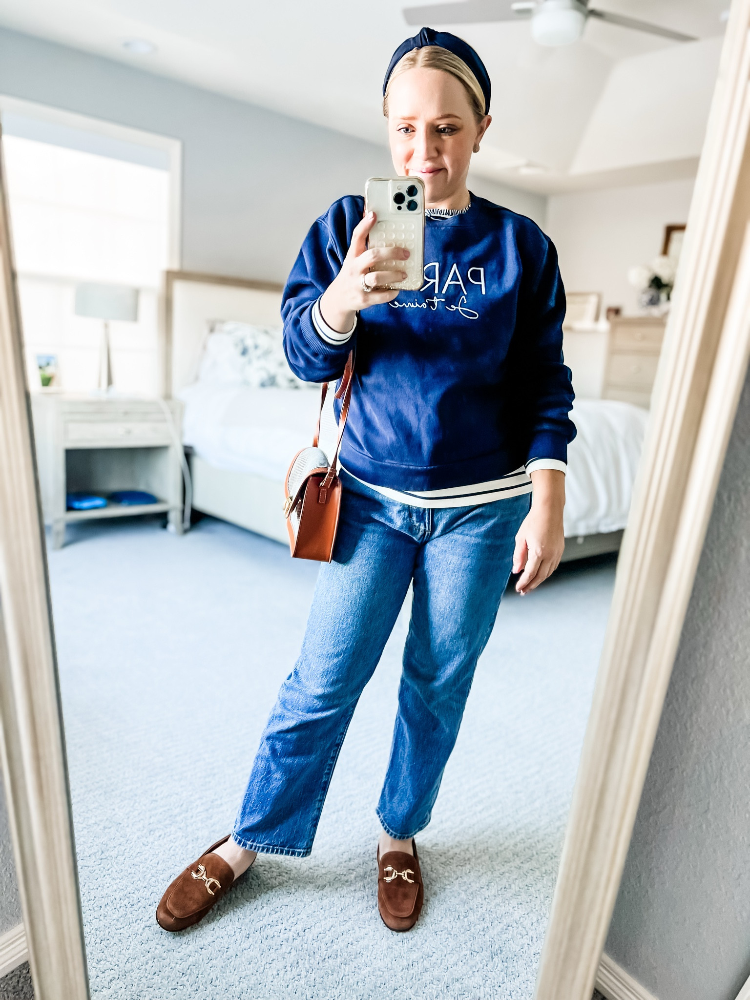 Sized down to xs in this cozy navy sweat shirt. It’s great with a layered  shirt or collared shirt underneath! Similar straight jeans and bag options. Exact suede loafers have a couple sizes in stock and are 60% off, fit tts. 

Winter outfit, straight jeans, petite outfit, casual outfit, graphic sweatshirt 

#LTKSaleAlert #LTKPetite #LTKFindsUnder100