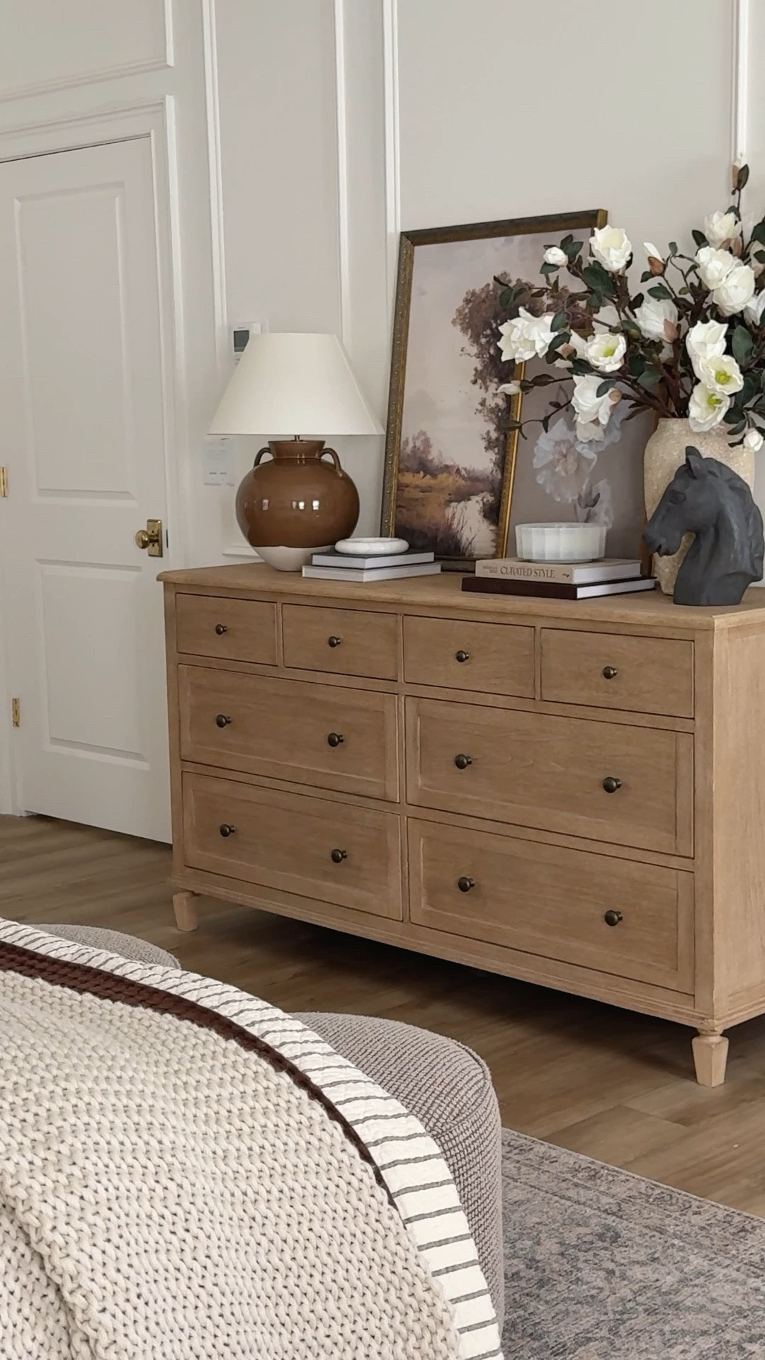 Collected, fall style inspo in my primary bedroom! Loving my neutral wood tone dresser with functional and aesthetic finds for a transition into cozy season. 

Home finds, neutral home inspo, fall refresh, neutral bedroom details, neutral wood tones, dresser favorites, table lamp, fall art, fall faux florals, faux magnolia stems, collected style, neutral decor book, wainscoting detail, Pottery Barn style, McGee and Co, Etsy, look for less, shop the look!

#LTKHome #LTKStyleTip #LTKSeasonal