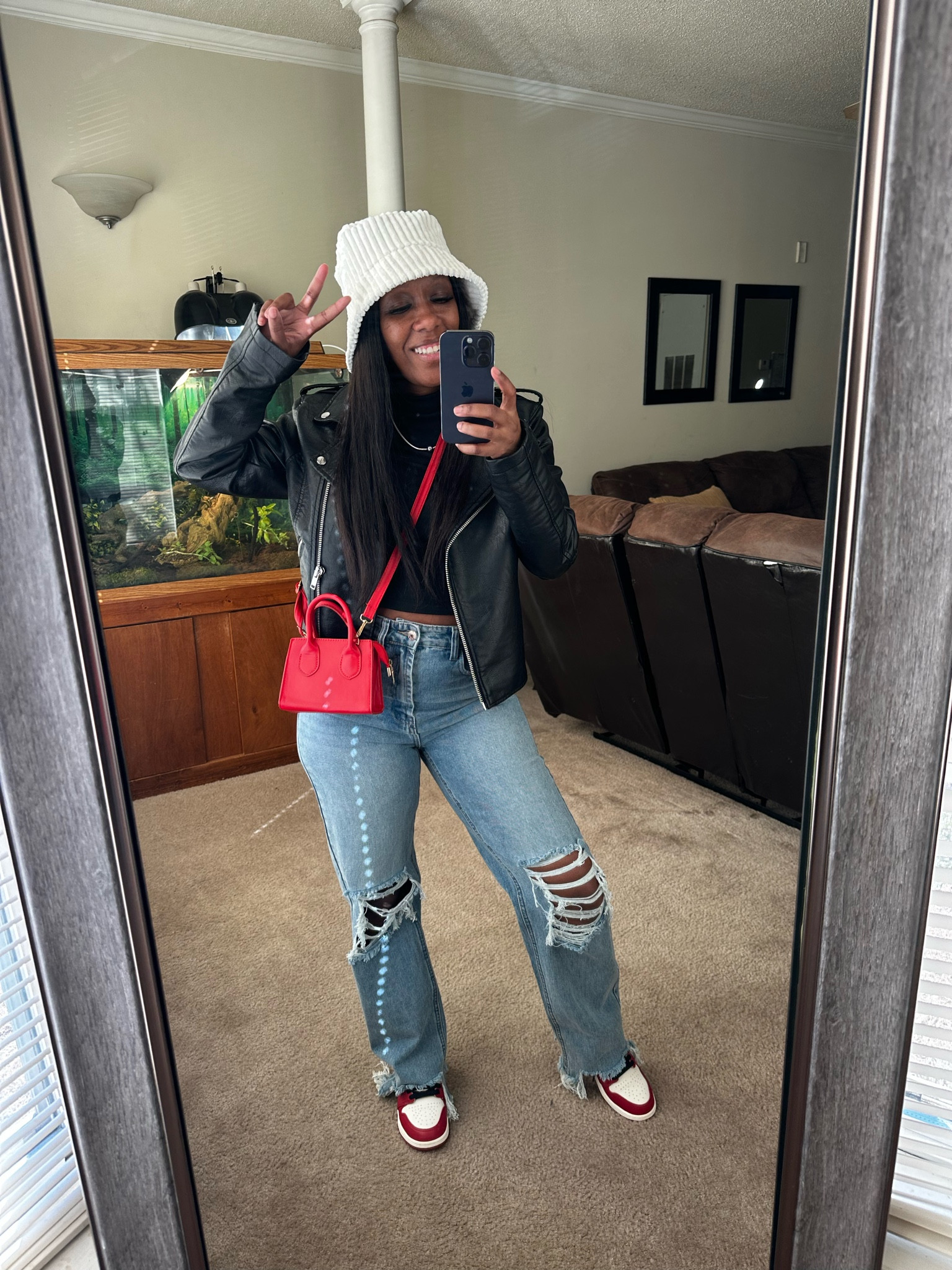 Casual date night outfits. I’m wearing a black long sleeve crop top, black faux leather jacket, high waisted distressed jeans, beige bucket hat, red crossbody bag, and Jordan 1 lost and found.

#LTKMostLoved #LTKstyletip #LTKshoecrush
