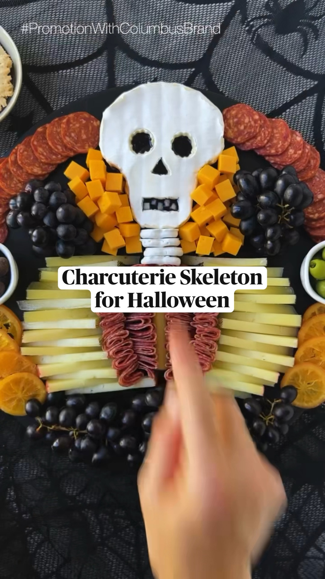 You can’t have a charcuterie skeleton without salami… Here I used @columbusmeats Italian Dry Salame to appropriately create the “innards” of the skeleton and their Charcuterie Tasting Board to fill out the spread with complementary cheese & charcuterie pairings so your guests can have the perfect bite!  
  
INGREDIENTS 
* 13 oz brie 
* 2 oz blueberry jam 
* 4 yogurt covered pretzels 
* string cheese
* 16 oz young manchego, sliced evenly lengthwise & height wise into triangles
* 12 oz @columbusmeats Italian Dry Salame 
* @columbusmeats Charcuterie Tasting Board (I used the Calabrese Salame, Castelvetrano olives & chocolate covered cranberries from here)
* 10 oz mild cheddar, cubed 
* 30 oz dark purple grapes 
* 8 dried orange slices 
  
INSTRUCTIONS 
1. Place brie in the freezer for 15-20 minutes to allow for easier cutting. 
2. For the brie skull, cut wedges out of the sides of the bottom third of the cheese (to make a mushroom-like shape), then carefully slice the brie in half. 
3. Using the top half of the brie, use a paring knife to cut out a rectangle for the mouth, a triangle for the nose and circles for both eyes. NOTE: suggest using a small round cookie cutter for the eyes. 
4. Use one slice of the manchego to create 5 small square “teeth” to be placed in the mouth after step 5. 
5. Dollop blueberry jam on bottom half of brie, then cover with the top half of the brie. 
6. Place the manchego teeth in the mouth. 
7. Once the skull is assembled, trim and perfect any edges of the skull before placing at the top of your board. NOTE: I took some of the sides off to make it narrower.  
8. Place the yogurt covered pretzels under the brie skull to create a neck, then place string cheese directly under that. 
9. On each side of the string cheese, layer manchego slices (alternating triangles) into a crescent shape to create the ribcage. 
10. Fold the @columbusmeats Italian Dry Salame into quarters and line inside of the “manchego ribcage.” 

#LTKhome #LTKparties #LTKHoliday
