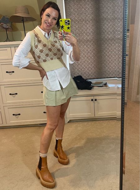 It’s giving Clueless 90’s/earyl 2000’s vibe and I’m all for it! I love pairing a skirt with a button down and sweater vest. Cute, classy and stylish! Wearing size small in shirt, vest and skirt. Wearing size 7.5 in shoes. 

#LTKSeasonal #LTKover40 #LTKstyletip