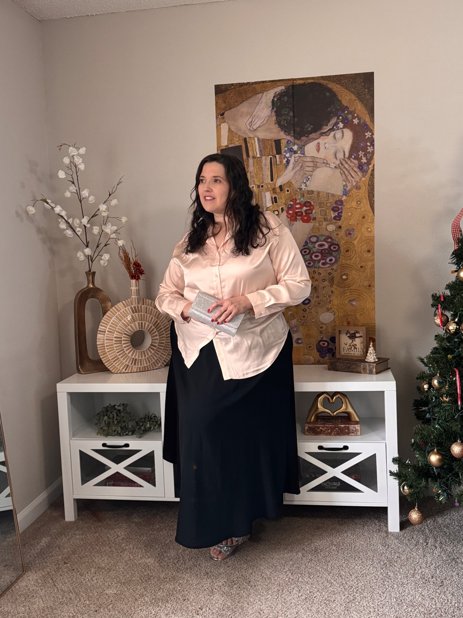 This elegant satin button-down blouse paired with a flowing maxi skirt is a timeless outfit that flatters beautifully while remaining comfortable and wearable. The satin fabric adds a soft sheen that instantly elevates the look, making it perfect for holiday dinners, special gatherings, or elegant evenings out. The relaxed drape of the blouse balances perfectly with the fluid movement of the maxi skirt, creating a polished silhouette without feeling restrictive.

This outfit works beautifully for women who want classic style with modern comfort. Dress it up with heels and a clutch for formal occasions or keep it simple with minimal accessories for an understated, sophisticated vibe. These are wardrobe staples you’ll reach for season after season.

#LTKPlusSize #LTKHoliday #LTKootd