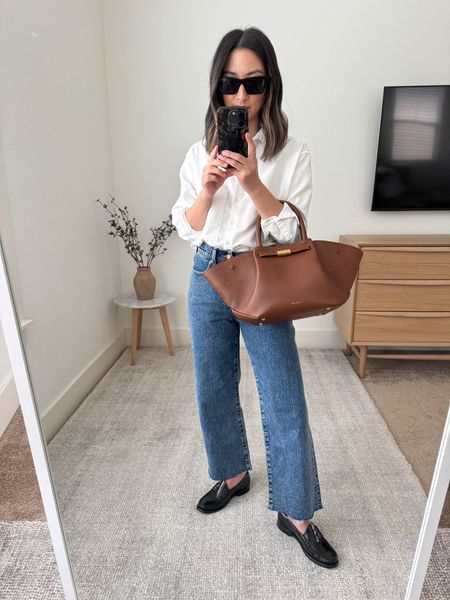 Simple everyday elevated outfit. White button down. This is my favorite white button down. It’s oversized, keeps its shape, and drapes really beautifully. 

AYR shirt xs
J.crew jeans 24 petite 
J.crew loafers 5
DeMellier bag medium
Celine sunglasses  

#LTKshoecrush #LTKSeasonal