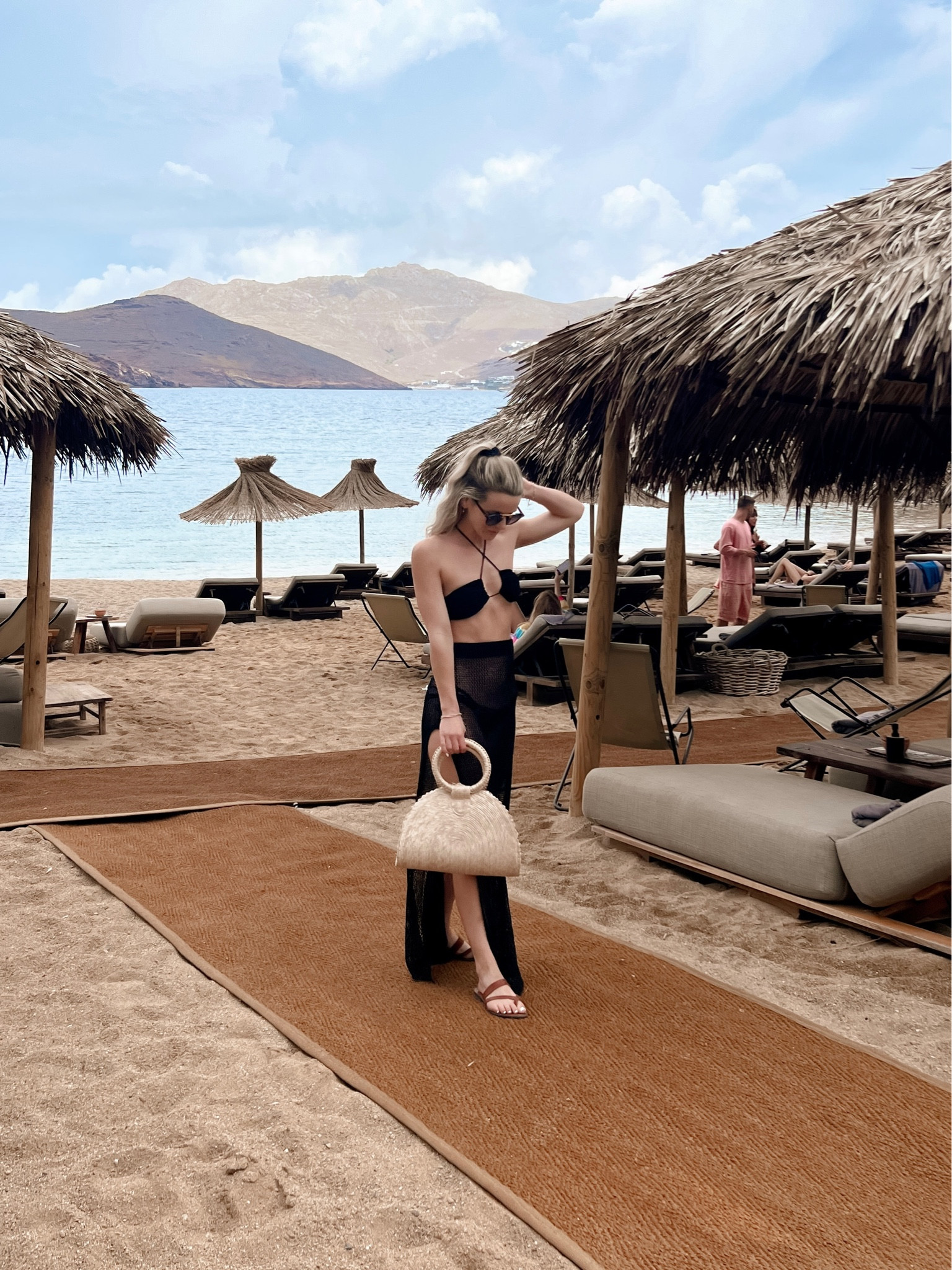 All black is always the perfect beach club outfit to wear in Mykonos. A classic straw bag is also a great addition, and I love the round handles of this affordable version.

#mykonosoutfit #greeceoutfit #whattowearingreece #blackbikini #blackcoverup #blackswimsuit

#LTKtravel #LTKswim #LTKeurope