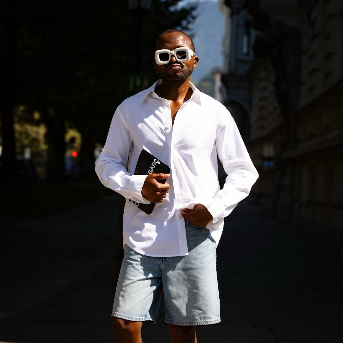 I am wearing a crisp, oversized white shirt from Massimo Dutti for an effortless, chic look. I added bold, inflated white sunglasses from Loewe, which added an edgy, avant-garde touch. The casual and laid-back look is maintained by my blue denim shorts from Weekday, while the black military loafers from Off-White add a polished, practical touch to the ensemble. To finish, I have a black clutch from Comme des Garçons that looks sophisticated and modern. This look combines clean lines with standout accessories to create a fashion-forward statement. Please share your thoughts in the comments.#EffortlessStyle #MassimoDutti #LoeweSunglasses #WeekdayDenim #OffWhiteShoes #CommeDesGarcons #ChicAndEdgy #StreetStyle #MinimalistFashion #FashionForward

#FashionMonth #LTKuk #LTKmens