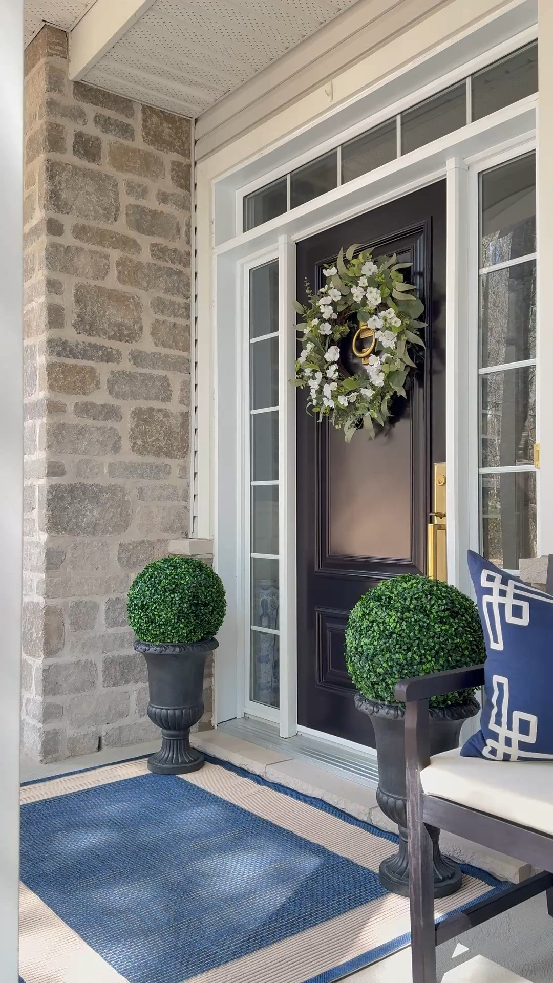 LOVING these elegant and chic urns, coastal rug and classic bench - they make a huge difference on our porch!!