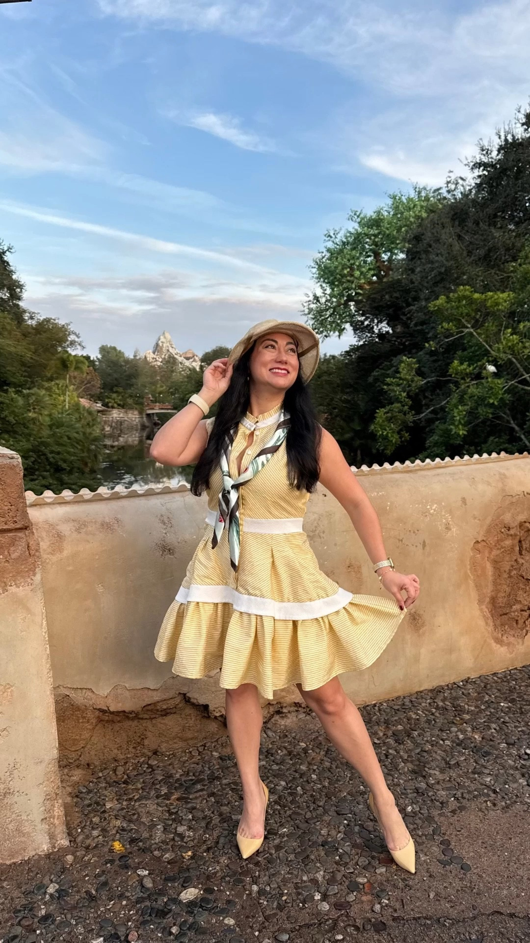 Disneybounding as Jane Porter from Disney’s animated classic Tarzan. 💛 This short, sleeveless mini dress has a gorgeous full skirt with ruffles, giving those turn of the century 1890s vibes. ✨🤩 Paired with a silk scarf, safari hat, and red bottom shoes to give Jane a more modern aesthetic. 🦍🦒🐘 Perfect outfit for Disney’s Animal Kingdom theme park! 🌳🫶🏼

#LTKTravel #LTKMidsize #LTKootd