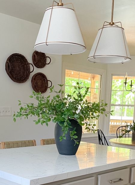 My greenery branches  have a very realistic look … I have three in this 12” tall vase. The vase is several years old, but linked a similar option. 

#LTKStyleTip #LTKHome #LTKSeasonal