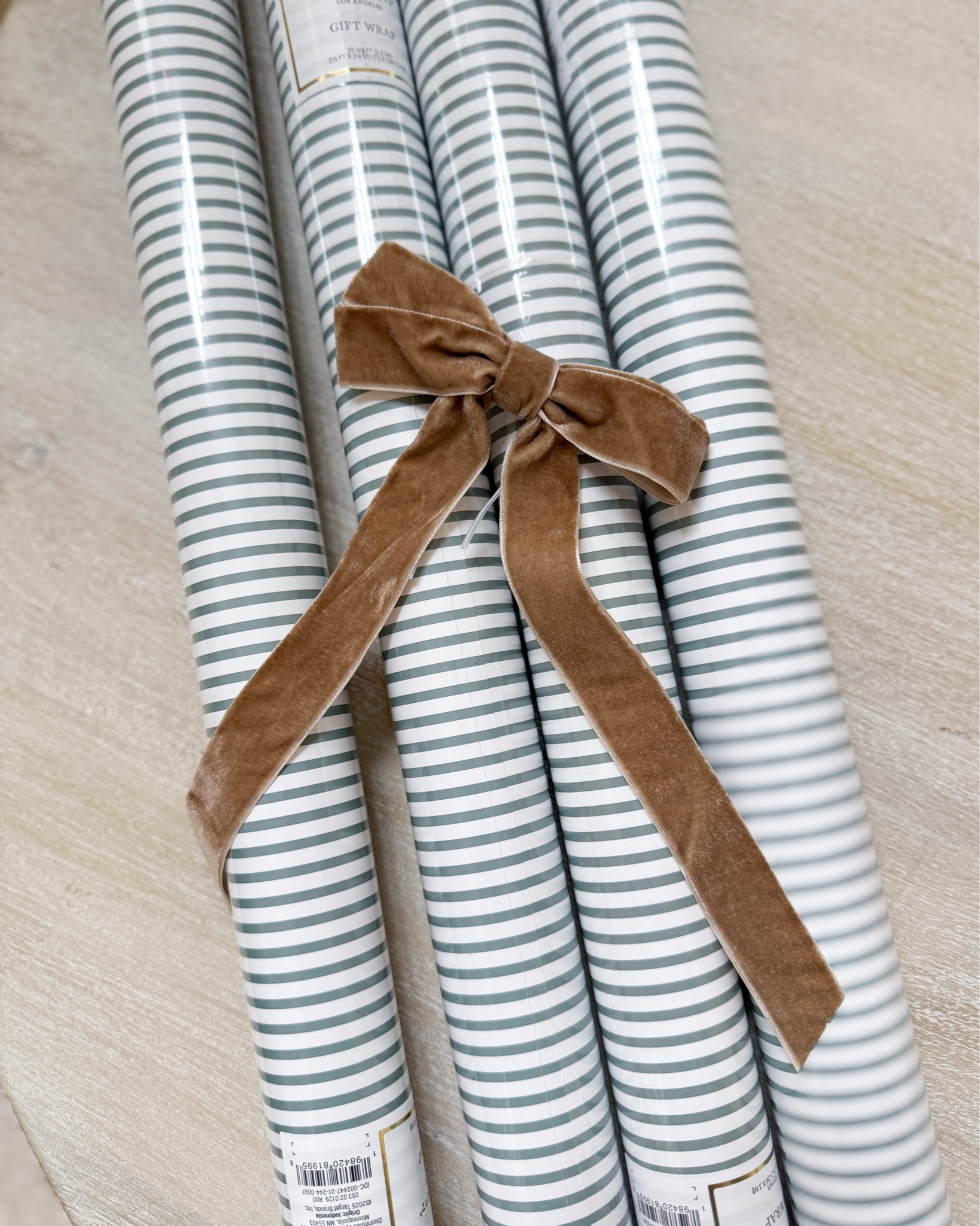 Fell super in love with this wrapping paper! Doing the stripes and trees with the tan & copper ribbon 🌲🎁

#LTKHoliday #LTKGiftGuide
