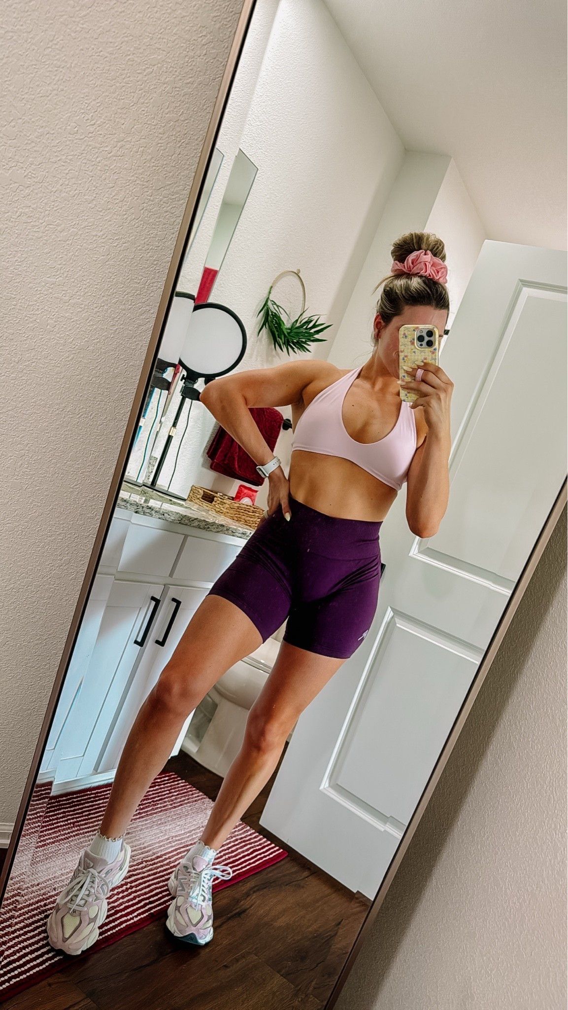 I’m wearing a medium in the shorts and a small in the sports bra!