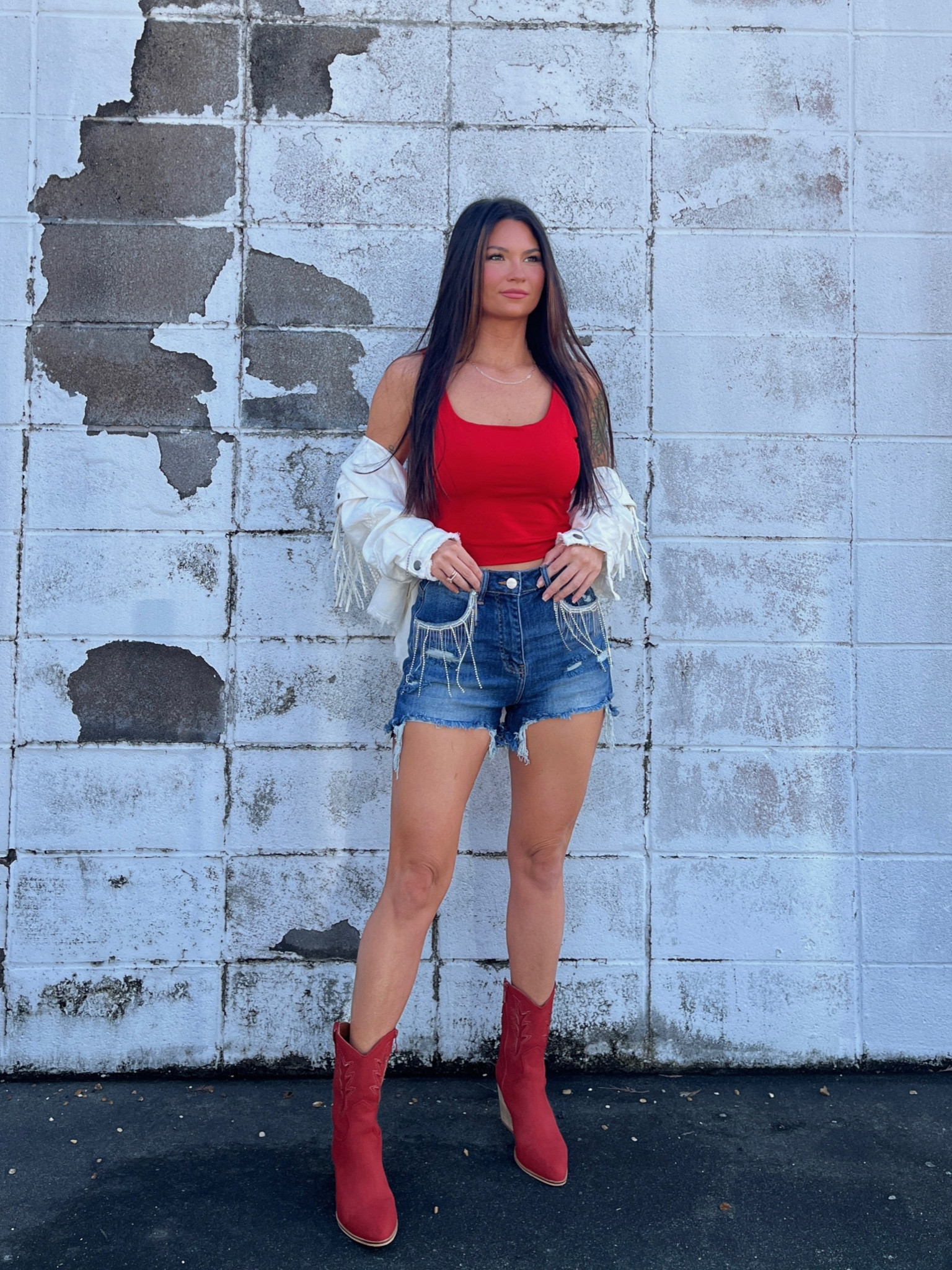 Red, white, and blue! Rhinestone shorts paired with white fringe denim jacket & red crop and western boots. LORI20

#LTKshoecrush #LTKstyletip #LTKunder100