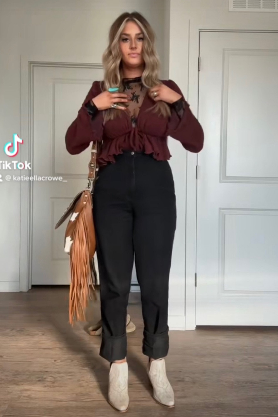 Tie top: https://www.bootbarn.com/wild-moss-womens-burgundy-tie-front-cropped-cardigan-sweater/2000368428.html?colorCode=640&glCountry=US&glCurrency=USD&gclid=CjwKCAiA0JKfBhBIEiwAPhZXDxkWu2JdhxPQCCeHMAejjeO4__t13p3KkH8eubweY2vKzjGf5Z-X0BoCz70QAvD_BwE

Boots: https://copperlanecollection.com/products/seneca-boots?utm_content=ios&utm_medium=product-links&utm_source=copyToPasteboard 