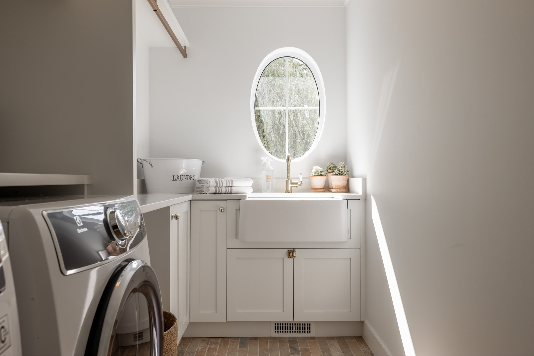 laundry room, coastal, oval window, brick floors 

#LTKMostLoved #LTKsalealert #LTKhome