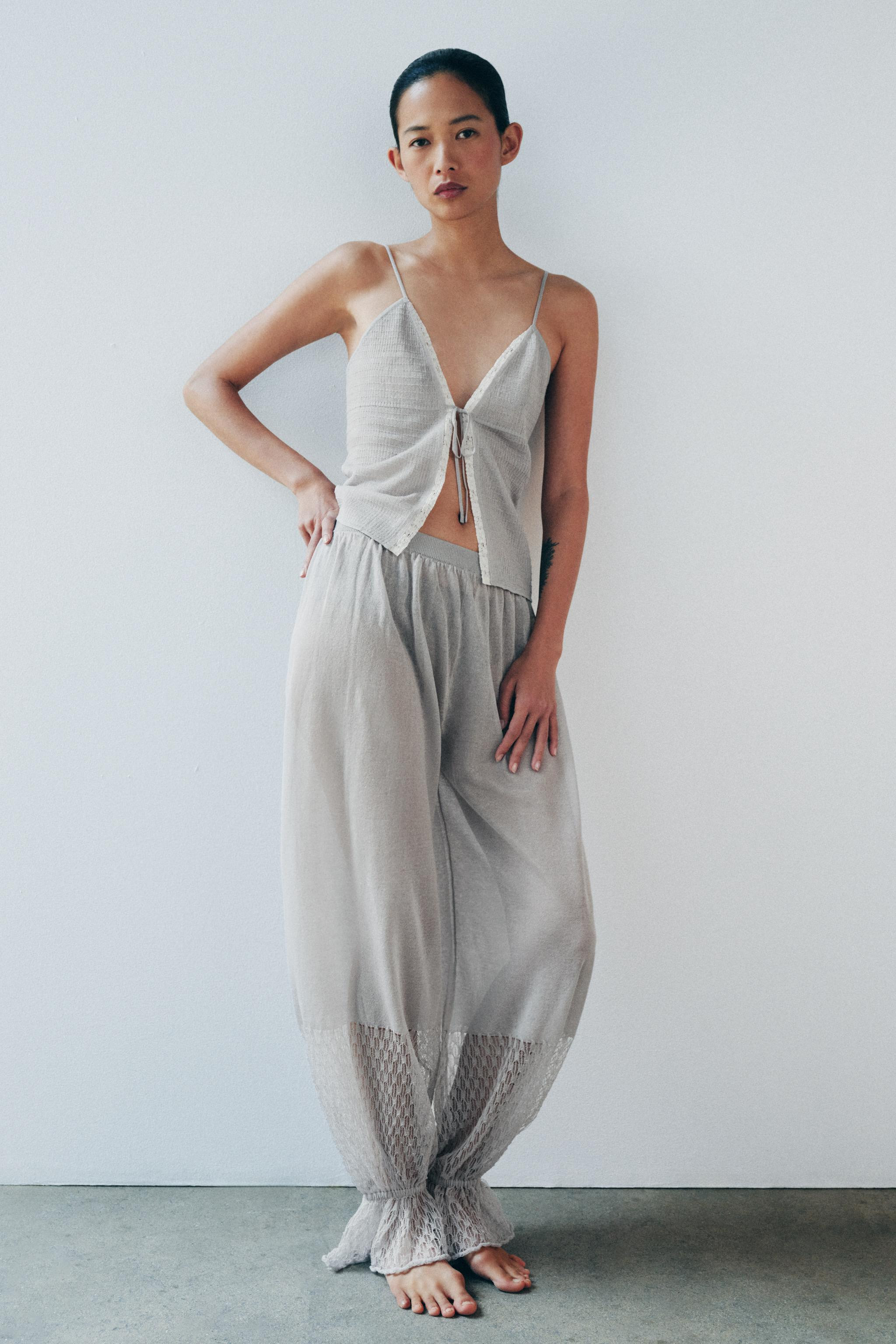 V-neck top with spaghetti straps. Features shirred fabric detailing and contrasting lace trim. Fr... | Zara US