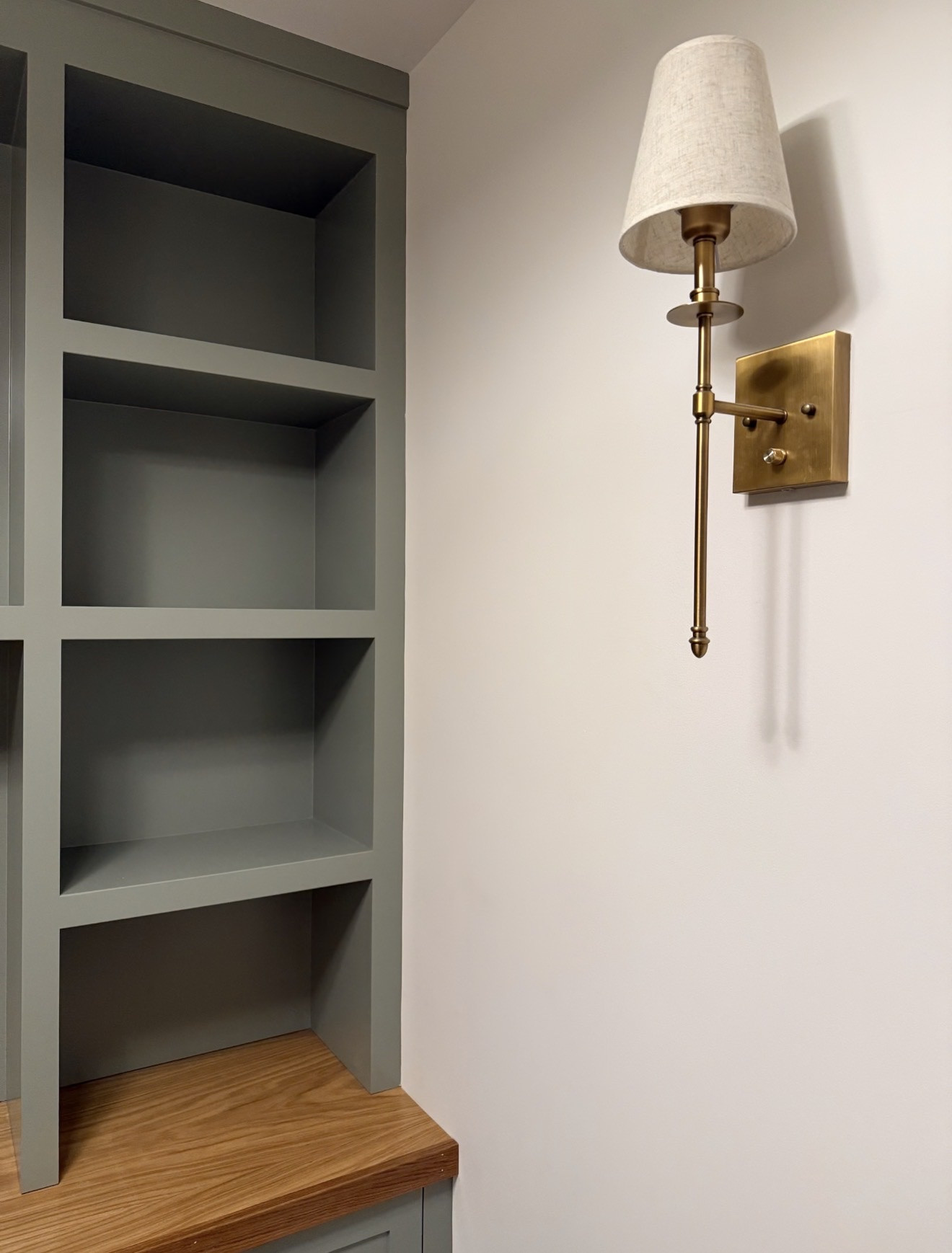 The built-ins are such a statement and this color completely transformed the space. Evergreen Fog is that perfect muted green that still feels neutral.

evergreen fog paint, built in shelving ideas, basement storage solutions, painted built ins, neutral paint colors, home organization ideas, custom shelving look, modern home design, cozy basement ideas, green cabinet color, home styling tips, girlonthehudson

#LTKHome