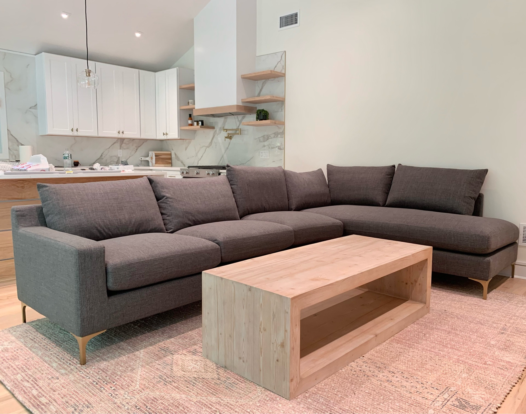 Living room is coming together. Absolutely love this couch, it’s so comfortable and stylish at the same time. You can choose your length and customize with fabric and legs. I chose performance fabric knit in Carbon and the brass mid century modern style. 

Sectional, couch, chaise, rug, coffee, table, wood, kitchen reno, living room, pottery barn, west elm, interior design. 
#ltksalealert
#competition

#LTKsalealert #LTKhome #LTKfamily