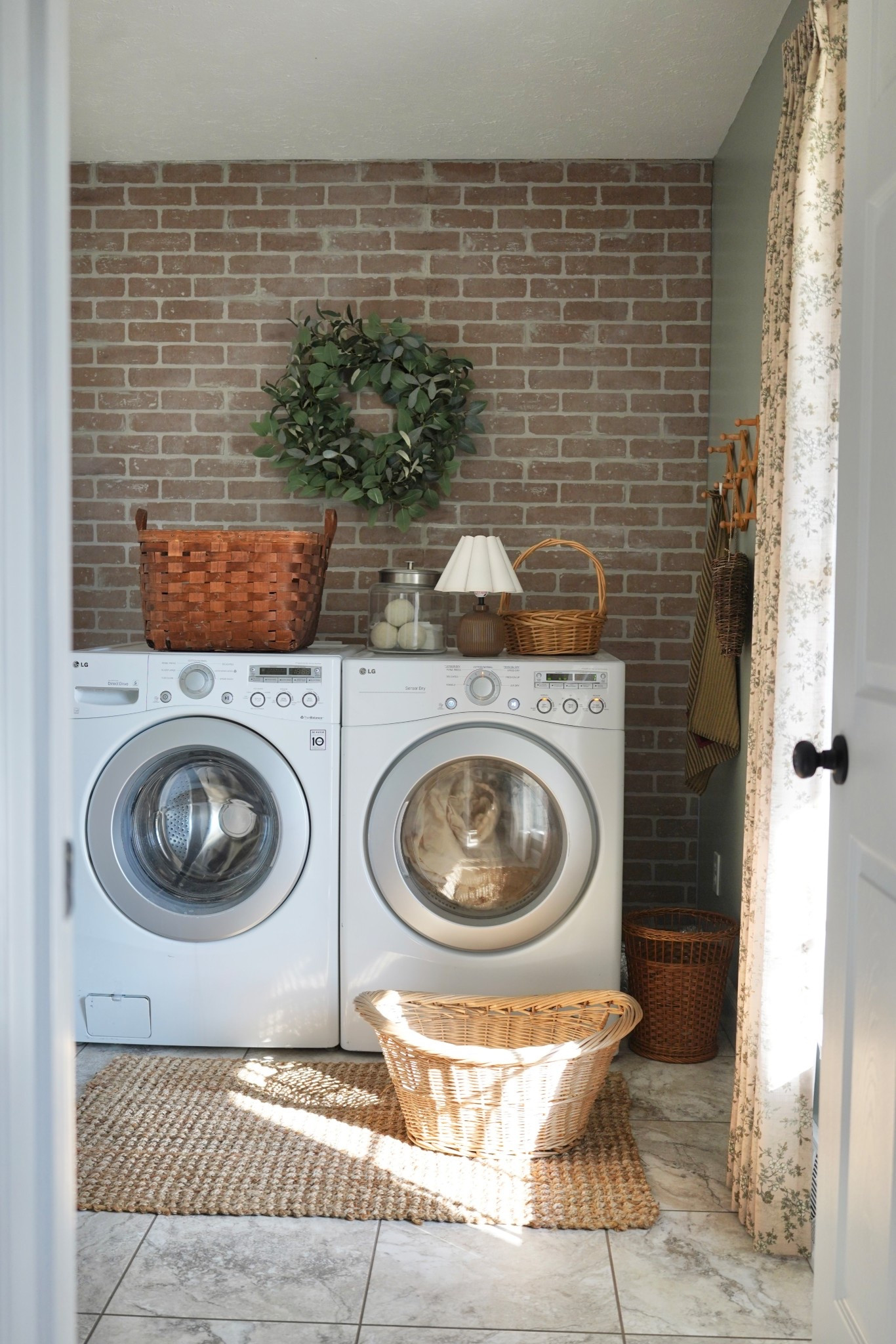 In my home, the first room that the sunshine pours into is the laundry room 🧺☀️ 
I got a new wreath from Target and I loveeee it, it’s even better in person. 

#laundryroomdecor #fauxbrick #cottagestyledecor #cottagestylehome #cozyhome | laundry room styling | laundry room | countryside living | country home | floral curtains | faux brick wall | spring wreath | cozy interiors | collected interiors | collected home

#LTKHome #LTKSeasonal