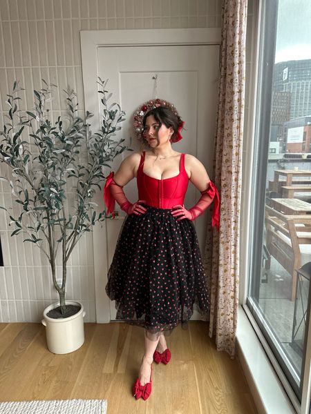 Love this black tutu skirt with glitter hearts all over! Perfect for Valentine’s Day date night! I styled it with a satin red corset to give it a pin up feel!

#LTKstyletip #LTKmidsize #LTKMostLoved