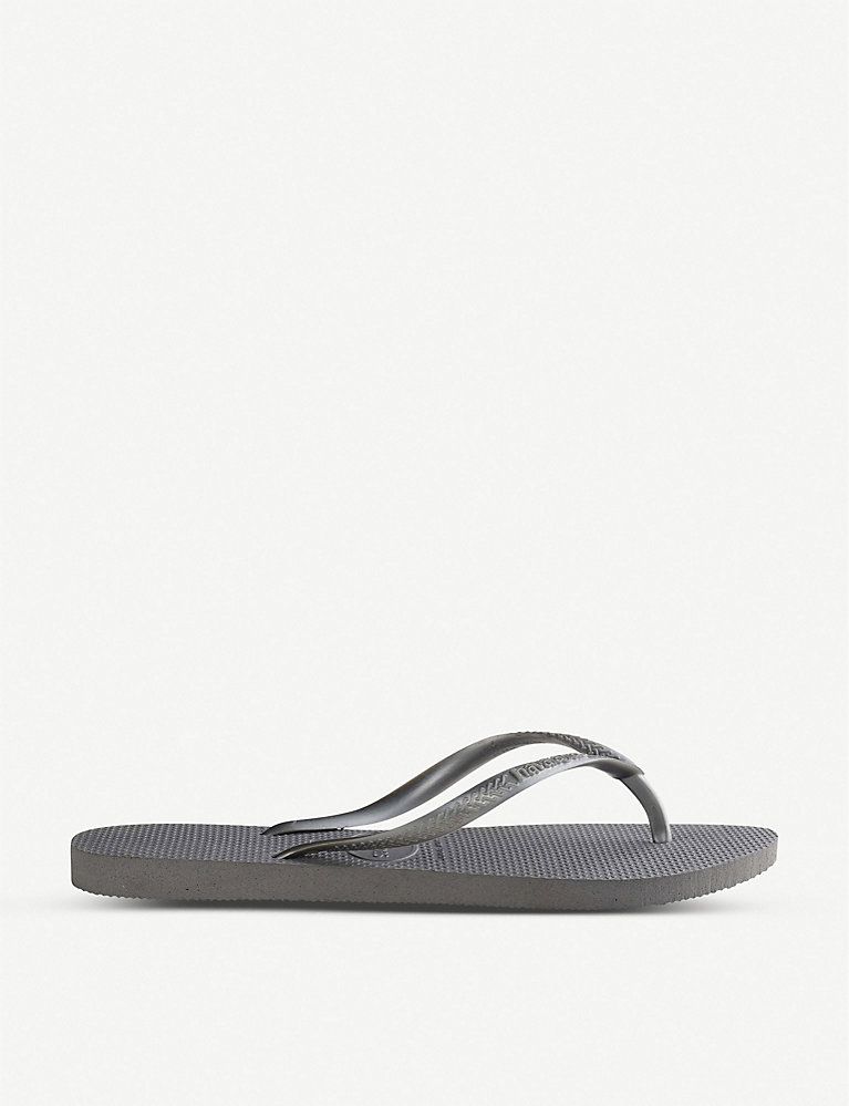 Logo-embellished rubber flip-flops | Selfridges