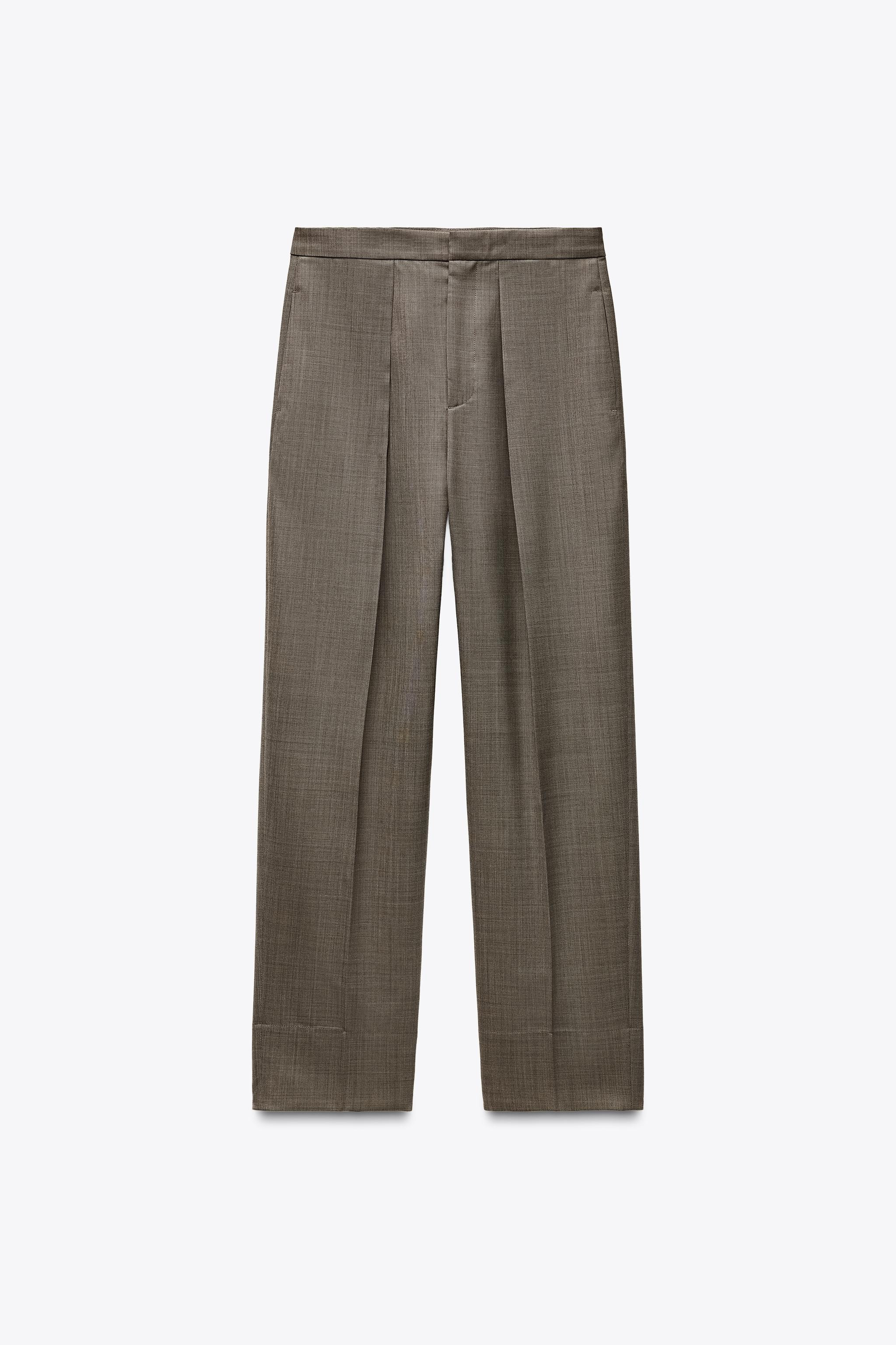ZARA WOMAN COLLECTIONMid-waist trousers made of spun wool. Side seam pockets. Front crease detail... | Zara UK