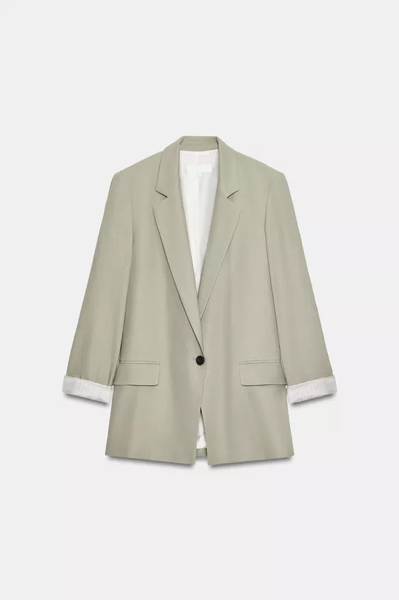 Linen blazer with lapel collar and long sleeves with shoulder pads, finished with rolled cuffs. F... | Zara US