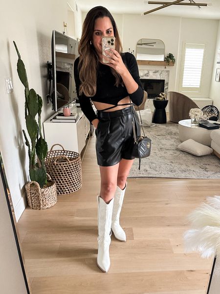 Wore this concert outfit recently! Early fall outfit, transition to fall fashion, white cowboy boots outfit, faux leather shorts. All run TTS wearing size small. I wear these white western boots year-round! So cute and comfy 

#LTKstyletip #LTKfindsunder100 #LTKover40