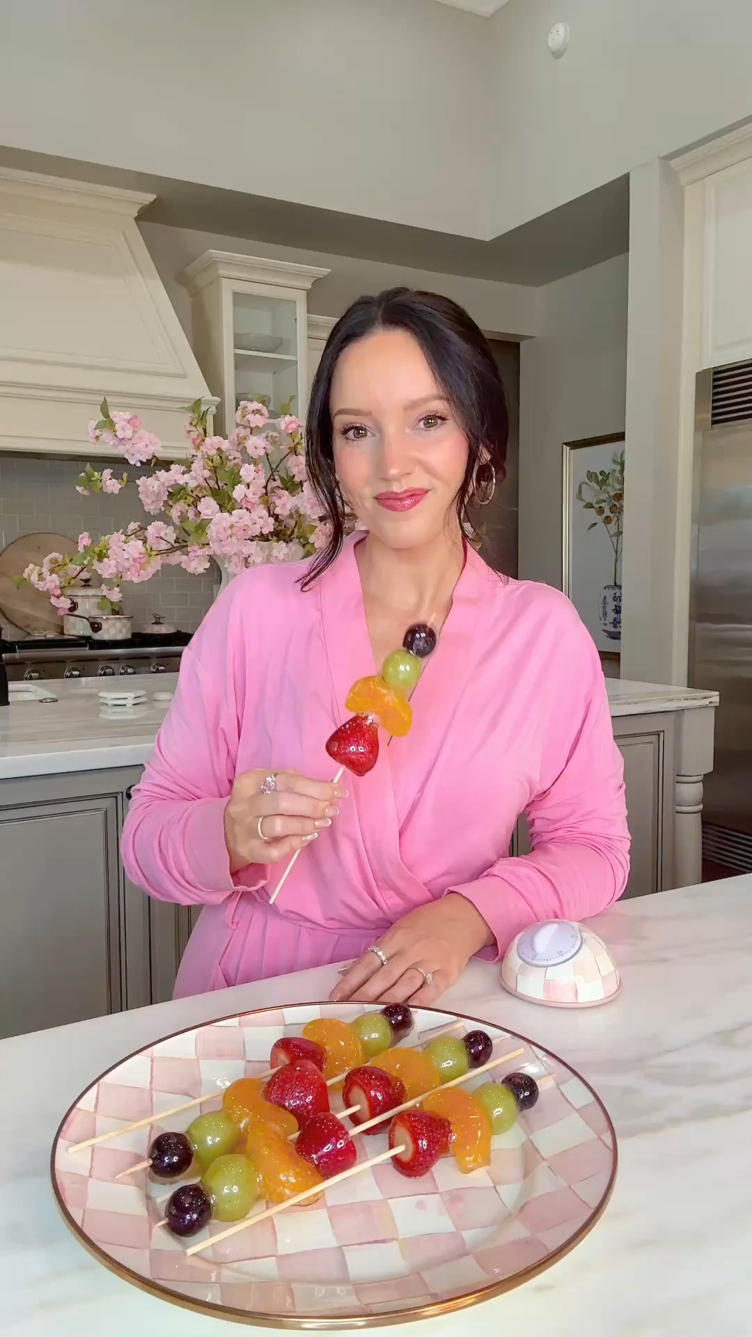Just a little afternoon pick me up 😉

These candied fruit screwers really are the perfect way to elevate a party / and or your everyday fruit plate to make it a treat ✨

INGREDIENTS:
- Fruit of your choice (I prefer fruit with skin to keep the juices in) 
- 2 cups sugar
- ½ cup water
- ½ cup karo syrup
- Vanilla + Edible glitter (optional)

Wash a dry fruit. Be sure to blot dry as much juice as possible otherwise candy will not stick. Place on skewers and freeze while making candy mixture. Boil sugar, water, and karo syrup for about 10 minutes until mixture is 300 degrees. You will want a candy thermometer to check temperature. Remove from heat immediately. Add food coloring, edible glitter, or flavoring (optional - love vanilla and or coconut). Dip cold fruit quickly (within 5 minutes) and place on parchment paper to harden. Enjoy immediately or same day. Store in freezer to ensure juices remain inside candied shell. Since some fruit isis juicier than others, the candied shell can leak juices if not stored in freezer. #easyrecipes #fruitplate #snackrecipes #partyrecipes #recipeidea

#LTKmomlife #LTKfoodie #LTKHome