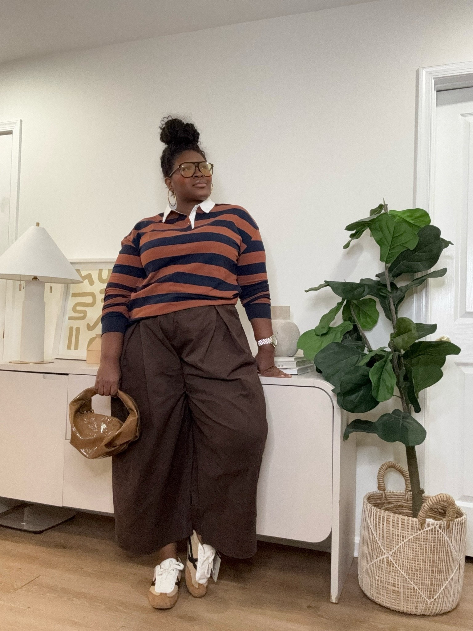 Stripes, relaxed tailoring, and neutral colors always create a timeless combination. This look balances comfort and style with a cozy sweater, flowy pants, and simple sneakers for an everyday outfit that still feels put together.  fall outfit ideas, plus size fall fashion, curvy fashion, striped sweater, rugby sweater, wide leg pants, brown pants outfit, casual fall outfit, neutral outfit ideas, cozy fall style, everyday outfit ideas, relaxed fit pants, classic fall wardrobe, women’s fashion inspiration

#LTKootd #LTKSeasonal #LTKMidsize
