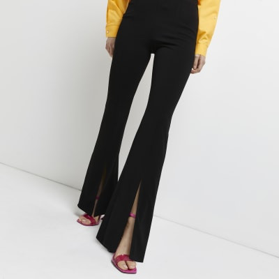 Black split front flared trousers | River Island (UK & IE)