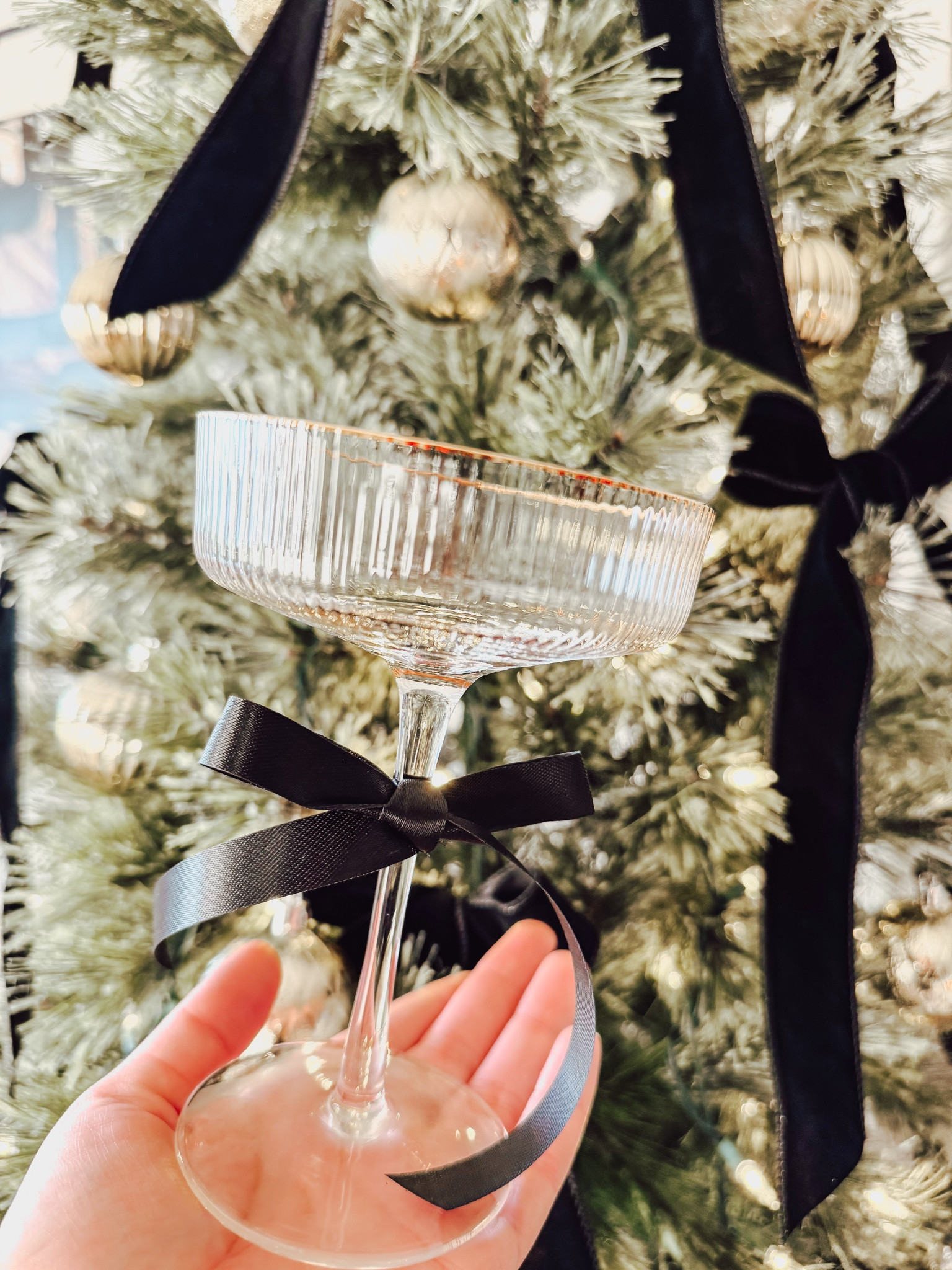 Gold rimmed coupe glasses are a must have for end of the year celebrations.  Add a ribbon for holiday perfection🌲✨

#LTKHoliday #LTKSeasonal #LTKFindsUnder50