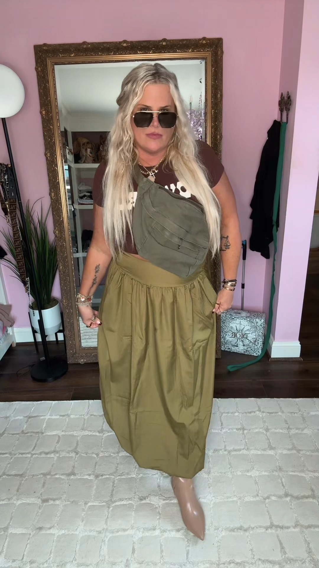 I am loving the sunnies just because it’s raining out it doesn’t mean we can’t dream of the sun 🌞, I’m obsessed with these little kitten heel booties. They are so soft and comfortable and I love this long skirt with a little bubble on the bottom and the leather jacket and the cool camo crossbody 

#LTKStyleTip #LTKMidsize #LTKOver40