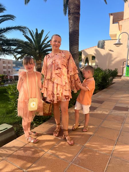 Ibiza holiday family outfit, night one

Ted baker coral ruffle mini dress
Strappy sandals, Zara (similar linked)
Girls coral dress, Next 
Girls Gold sandals, next
Girls bag, next
Boys orange t shirt, TU
Boys white shorts, Next 
Boys sandals, Matalan 

#LTKeurope #LTKfamily #LTKstyletip