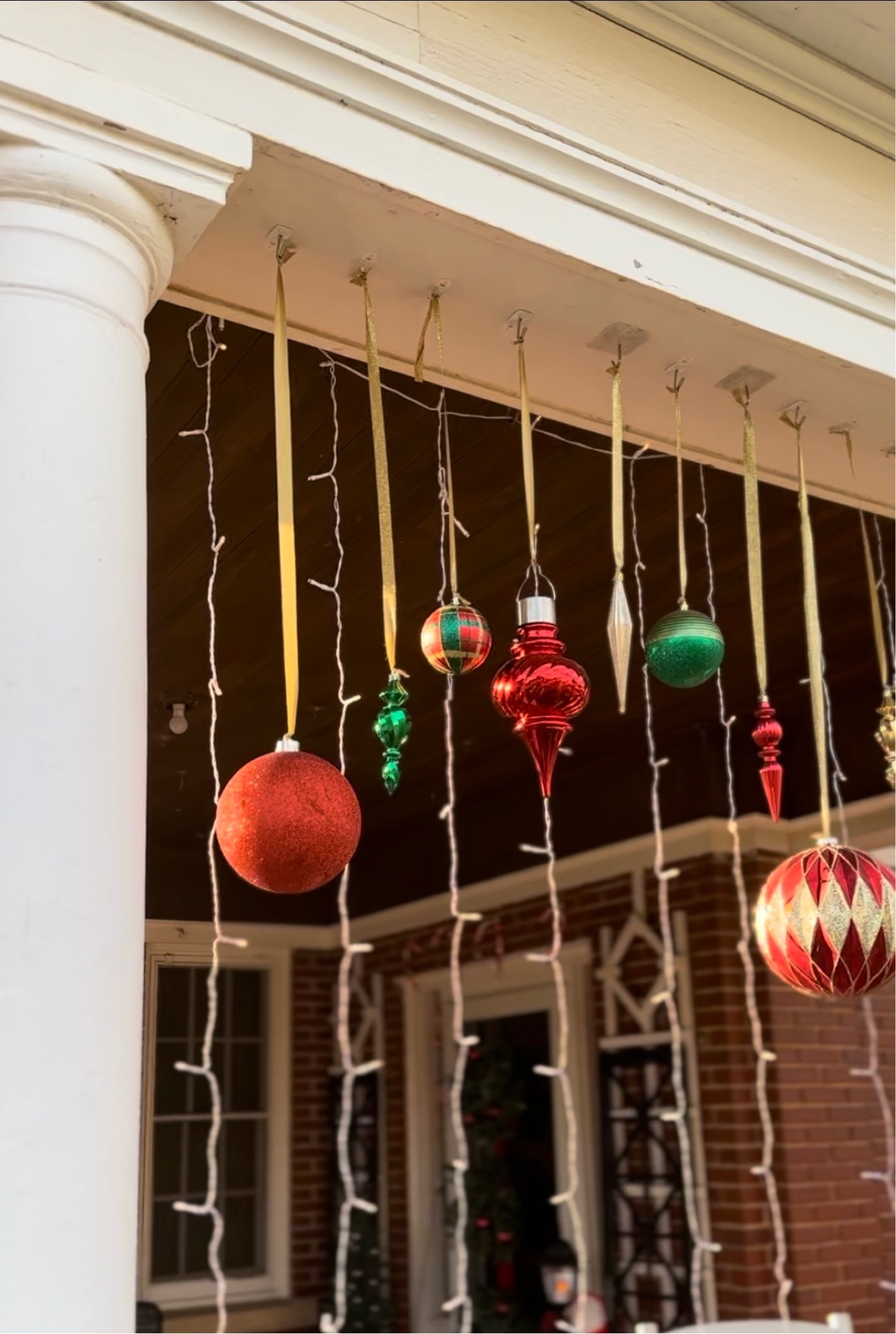 DIY Outdoor Hanging Christmas Ornament Display. 

#LTKHoliday #LTKSeasonal #LTKhome