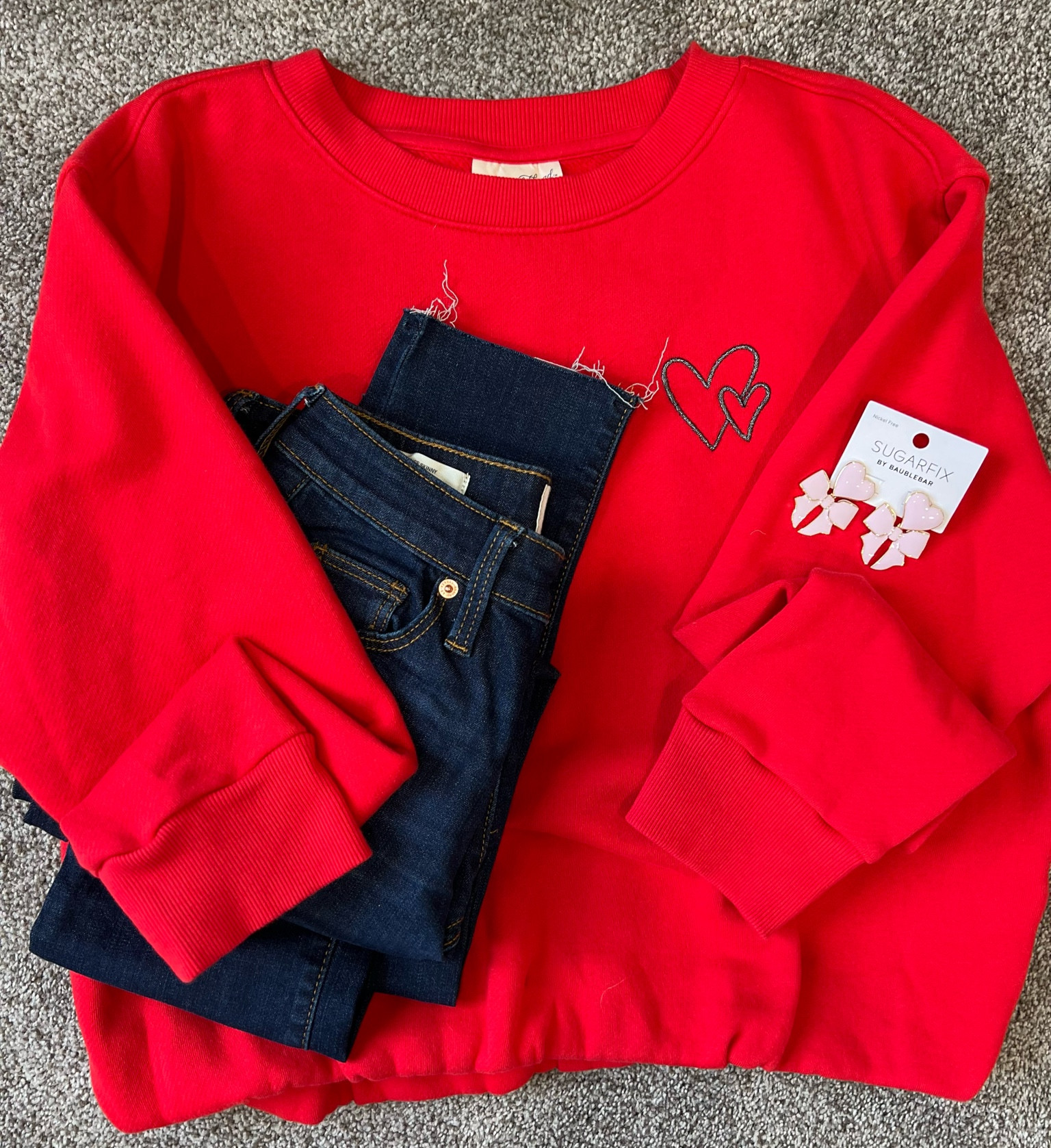 The cutest top!! 
Valentine’s Day outfit 
Cut off jeans
Bow earrings
Pink earrings

#LTKstyletip #LTKSeasonal #LTKfindsunder50